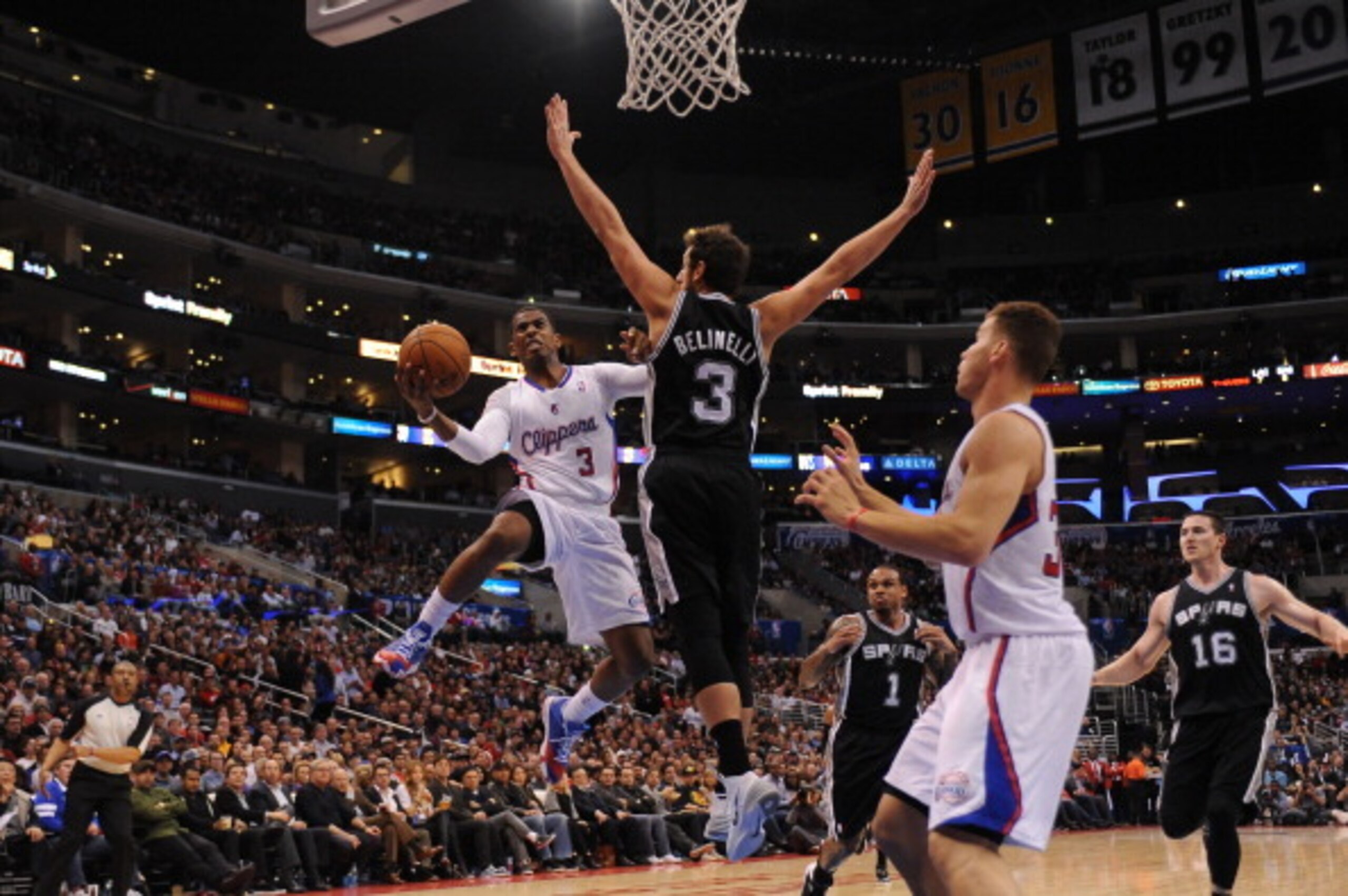 LOS ANGELES, CA - FEBRUARY 18: Chris Paul #3 of the Los Angeles Clippers shoots against Marco Belinelli #3 of the San Antonio Spurs at STAPLES Center on February 18, 2014 in Los Angeles, California. NOTE TO USER: User expressly acknowledges and agrees tha