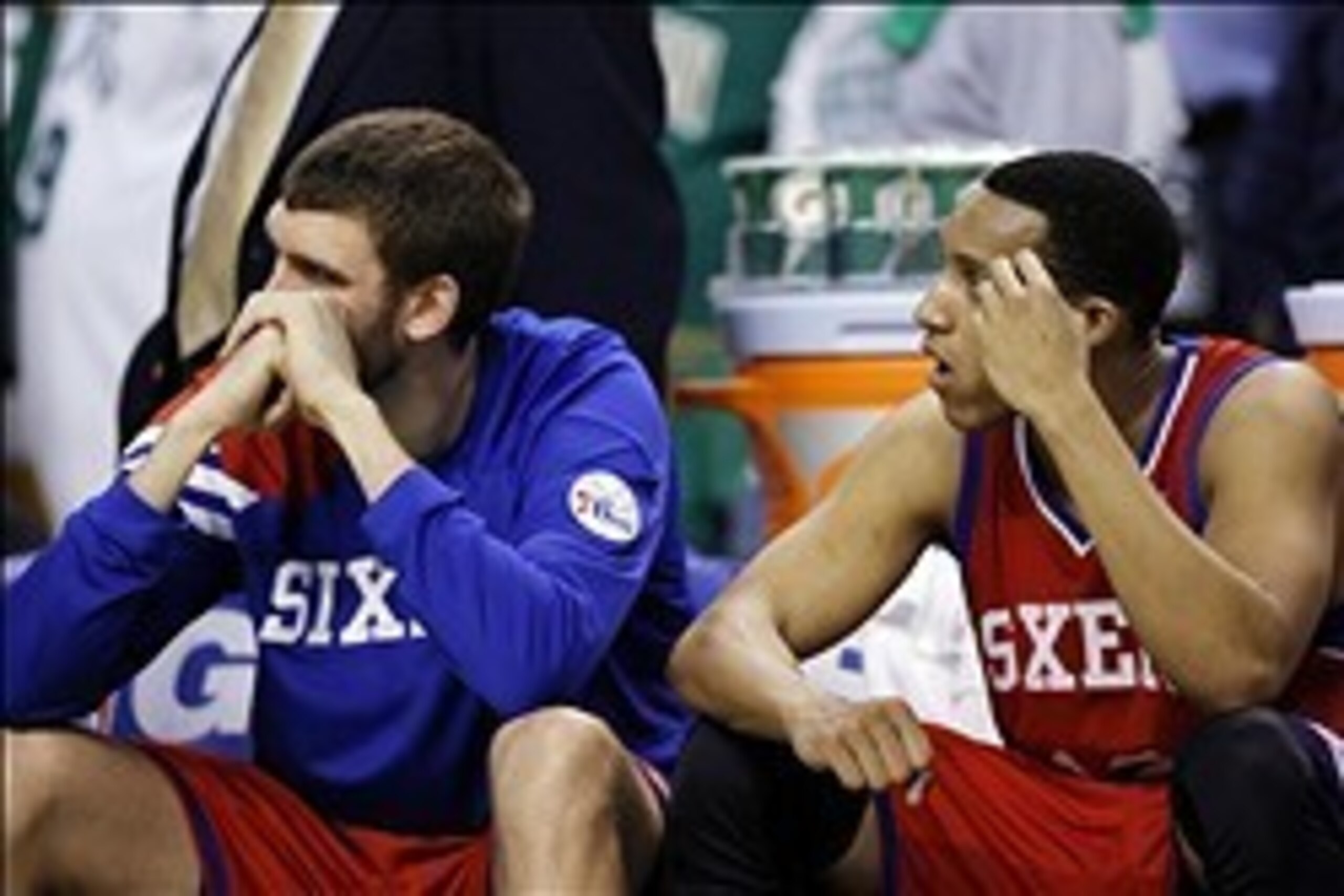May 26, 2012; Boston, MA, USA; Philadelphia 76ers center Spencer Hawes (left) and shooting guard Evan Turner (right) on the bench during the final seconds of the fourth quarter against the Boston Celtics in game seven of the Eastern Conference semifinals 