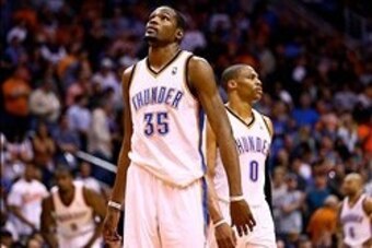 Mar 6, 2014; Phoenix, AZ, USA; Oklahoma City Thunder forward Kevin Durant (35) and guard Russell Westbrook (0) react during the fourth quarter against the Phoenix Suns at the US Airways Center. The Suns defeated the Thunder 128-122. Mandatory Credit: Mark