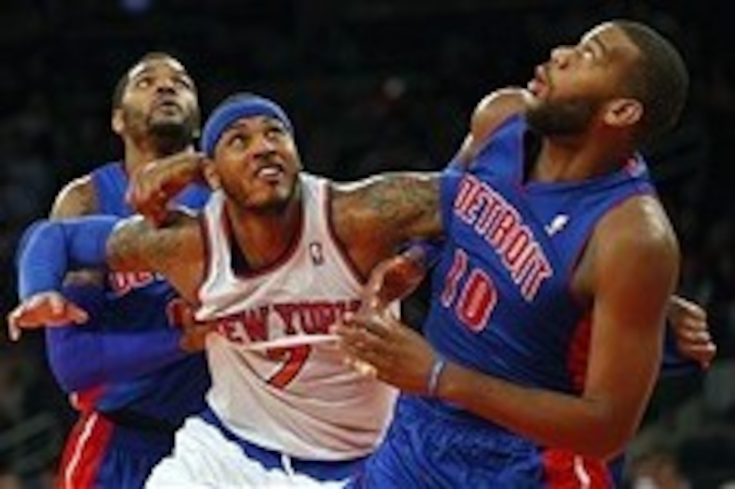 Jan 7, 2014; New York, NY, USA;  New York Knicks small forward Carmelo Anthony (7) battles Detroit Pistons power forward Greg Monroe (10) and small forward Josh Smith (6) for rebound in closing seconds of game at Madison Square Garden. New York Knicks def
