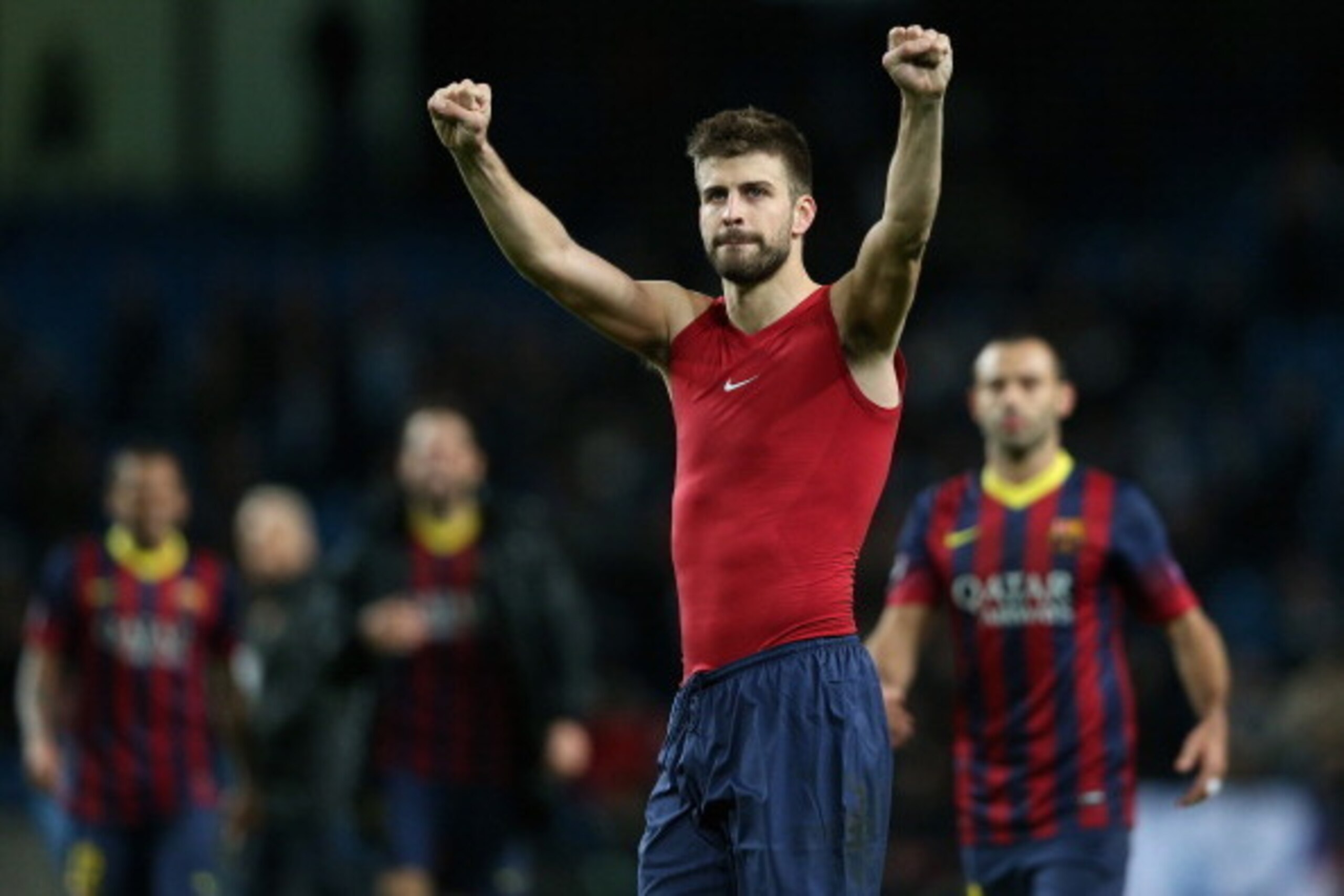 MANCHESTER, ENGLAND - FEBRUARY 18:  Gerard Pique of Barcelona celebrates at the end of the UEFA Champions League Round of 16 first leg match between Manchester City and Barcelona at the Etihad Stadium on February 18, 2014 in Manchester, England.  (Photo b