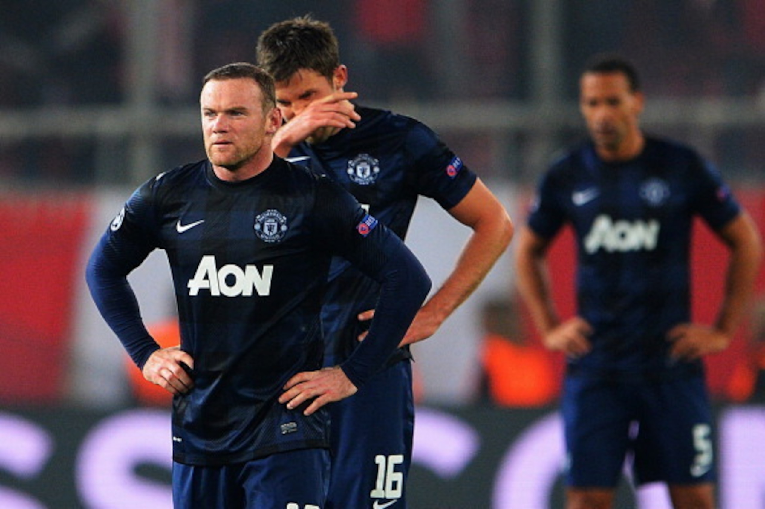 PIRAEUS, GREECE - FEBRUARY 25:  (L-R) Wayne Rooney and Michael Carrick of Manchester United react as they restart the game after conceding their second goal during the UEFA Champions League Round of 16 first leg match between Olympiacos FC and Manchester 