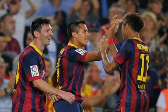BARCELONA, SPAIN - OCTOBER 26:  Alexis Sanchez (C) of FC Barcelona celebrates with team-mates Lionel Messi (L) and Neymar after scoring their team's second goal during the La Liga match between FC Barcelona and Real Madrid CF at Camp Nou stadium on Octobe