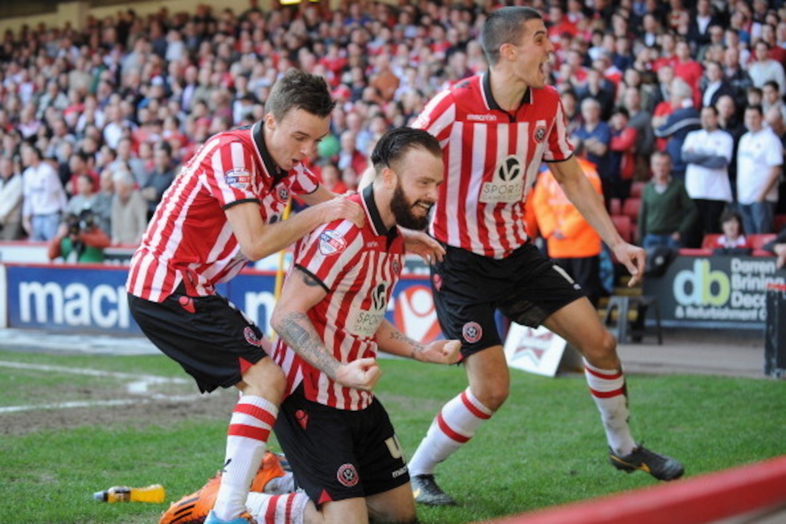 SHEFFIELD, ENGLAND - MARCH 09:  John Brayford of Sheffield United celebrates scoring their second goal during the FA Cup Quarter-Final match at Bramall Lane on March 9, 2014 in Sheffield, England.  (Photo by Tony Marshall/Getty Images)