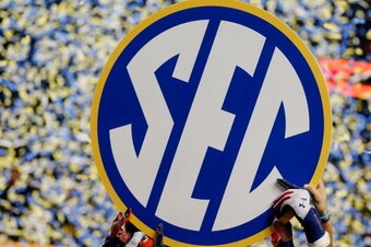 ATLANTA, GA - DECEMBER 07:  The Auburn Tigers hold up the SEC sign in celebration after defeating the Missouri Tigers 59-42 to win the SEC Championship Game at Georgia Dome on December 7, 2013 in Atlanta, Georgia.  (Photo by Kevin C. Cox/Getty Images)