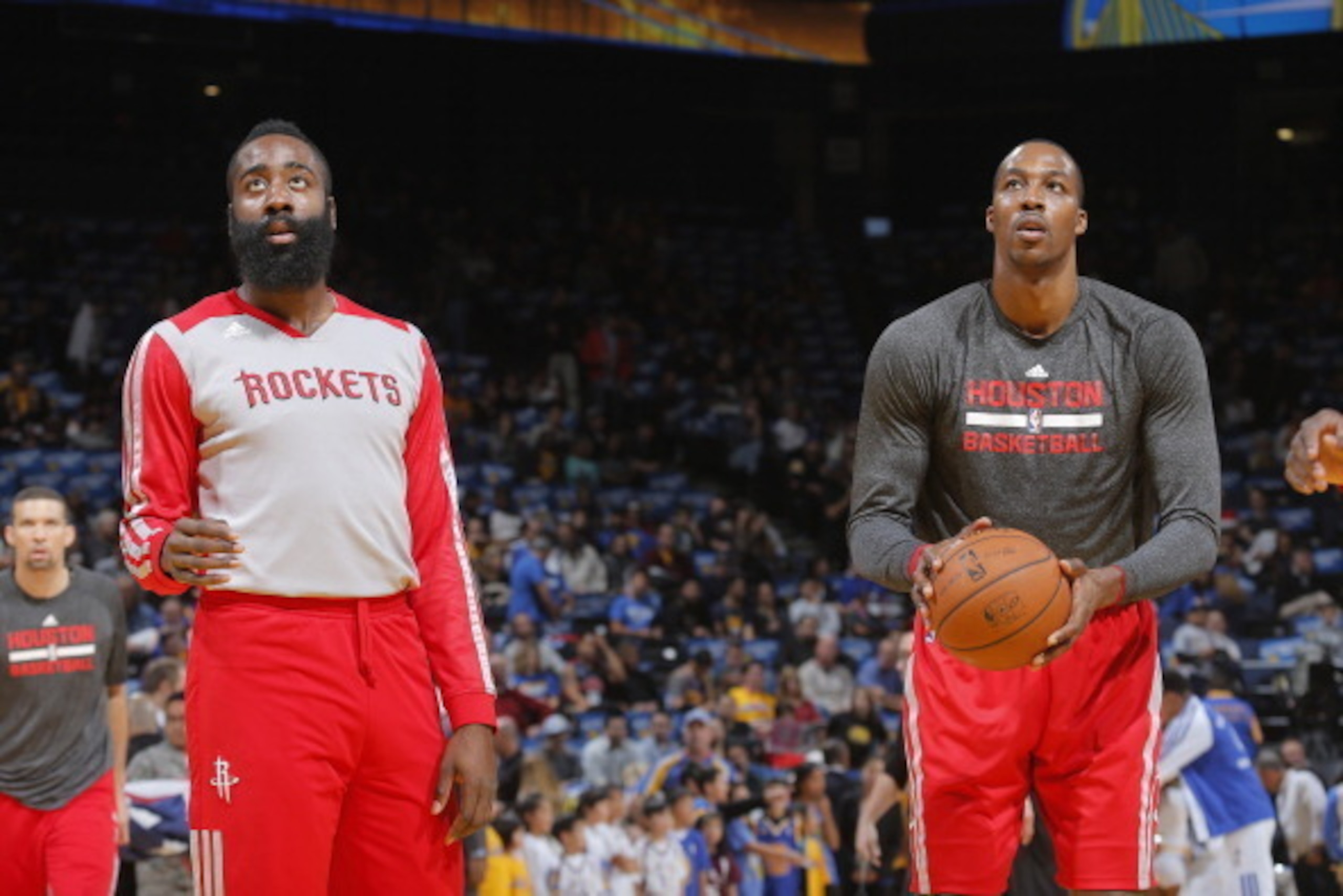 OAKLAND, CA - DECEMBER 13: James Harden #13 and Dwight Howard #12 of the Houston Rockets warm up prior to the game against the Golden State Warriors on December 13, 2013 at Oracle Arena in Oakland, California. NOTE TO USER: User expressly acknowledges and
