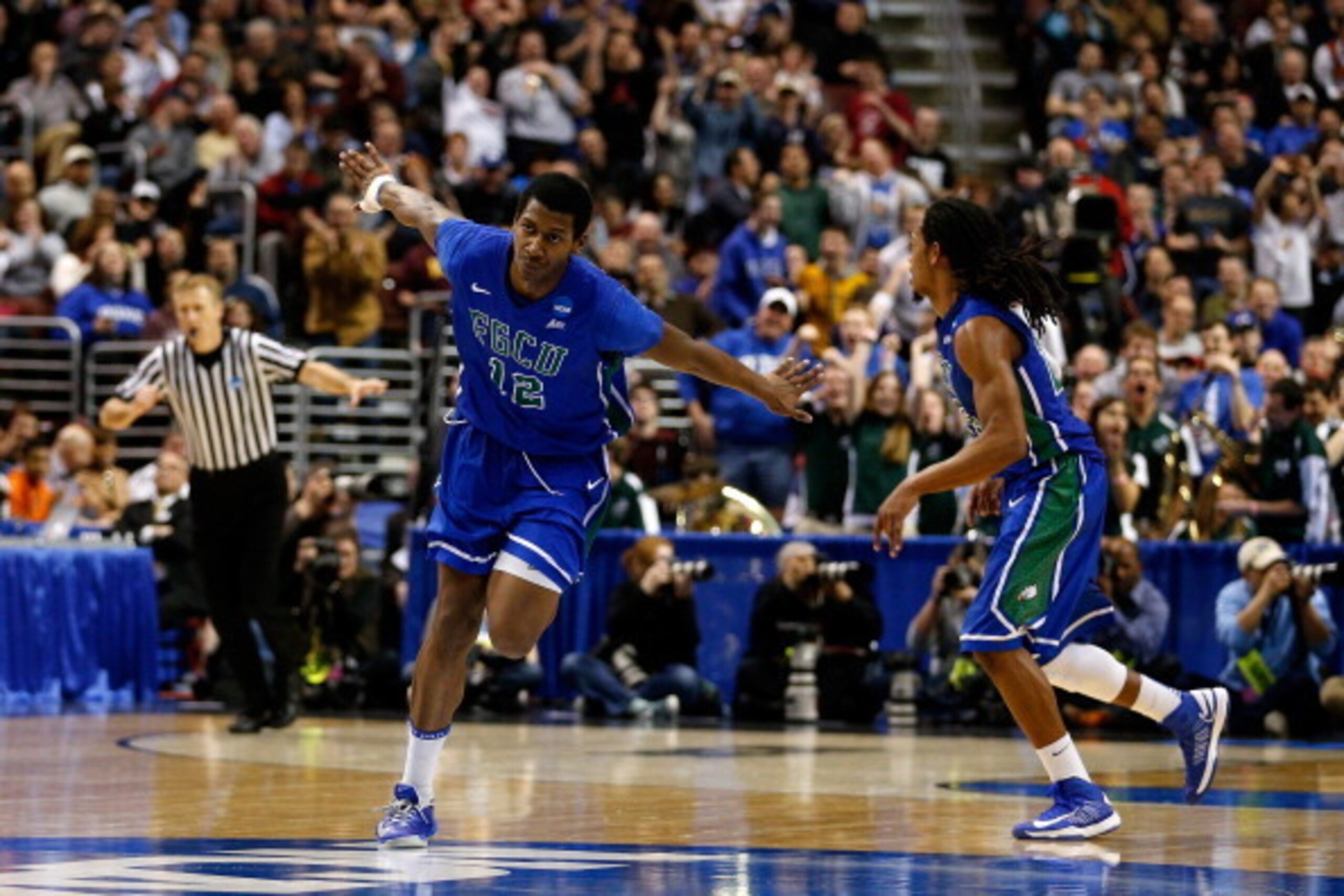 PHILADELPHIA, PA - MARCH 24:  Eric McKnight #12 of the Florida Gulf Coast Eagles celebrates in the second half while taking on the San Diego State Aztecs during the third round of the 2013 NCAA Men's Basketball Tournament at Wells Fargo Center on March 24