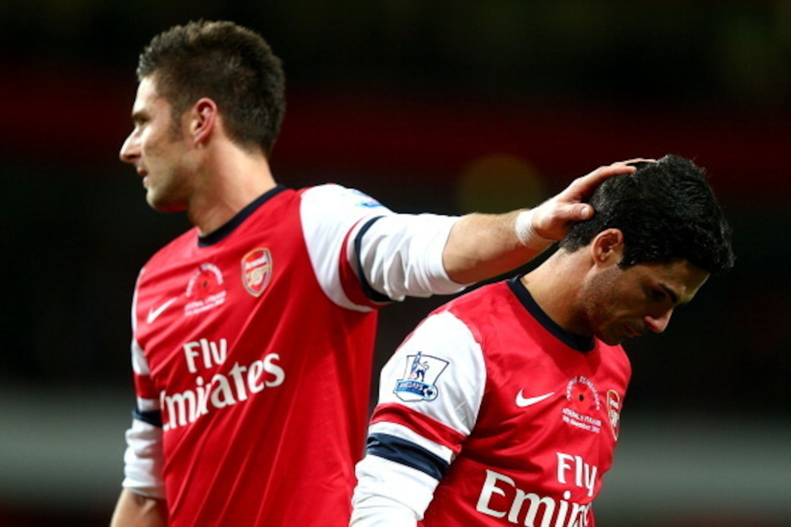 LONDON, ENGLAND - NOVEMBER 10: Mikel Arteta of Arsenal is consoled by Olivier Giroud after missing a match winning penaly kick during the Barclays Premier League match between Arsenal and Fulham at Emirates Stadium on November 10, 2012 in London, England LONDON, ENGLAND - NOVEMBER 10: Mikel Arteta of Arsenal is consoled by Olivier Giroud after missing a match winning penaly kick during the Barclays Premier League match between Arsenal and Fulham at Emirates Stadium on November 10, 2012 in London, England