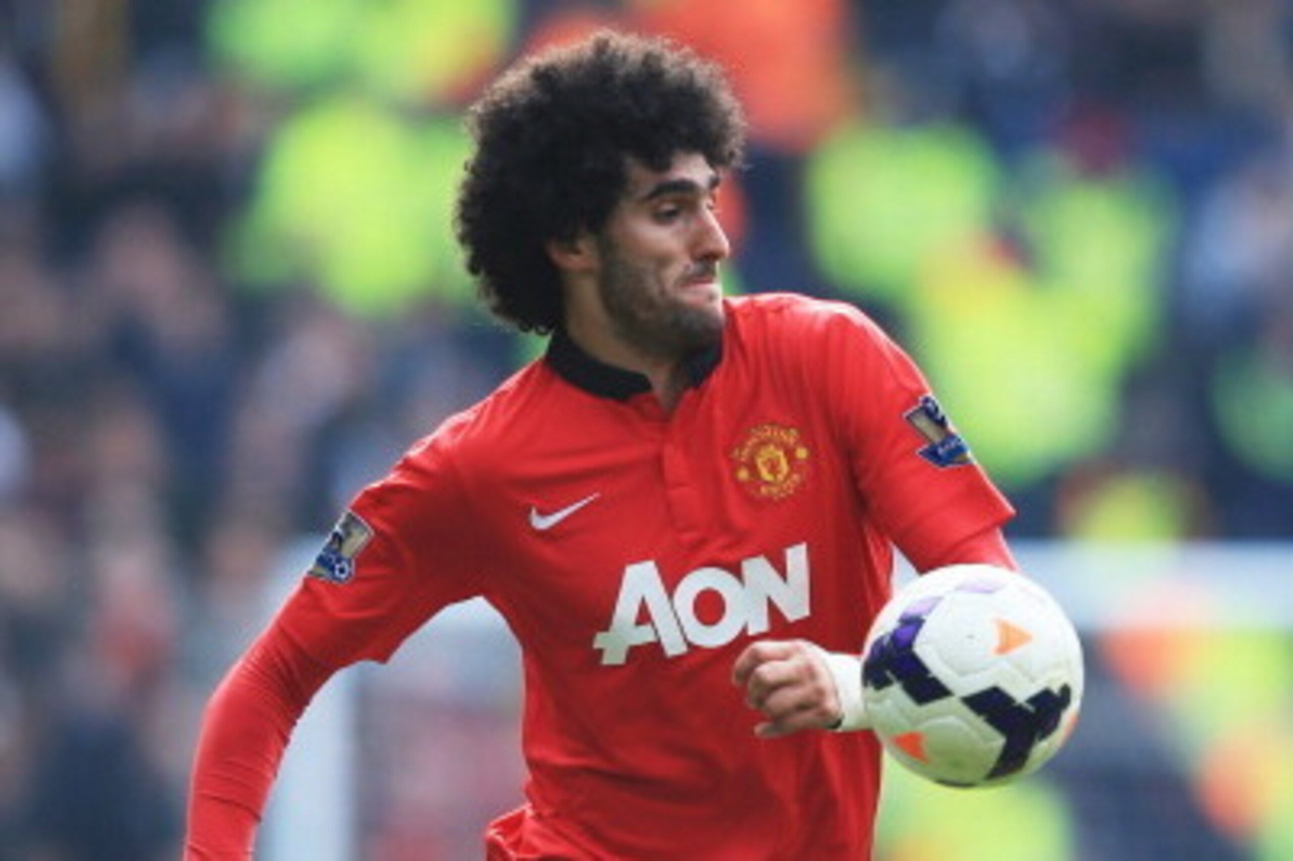 WEST BROMWICH, ENGLAND - MARCH 08:  Marouane Fellaini of Manchester United in action during the Barclays Premier League match between West Bromwich Albion and Manchester United at The Hawthorns on March 8, 2014 in West Bromwich, England.  (Photo by Richar