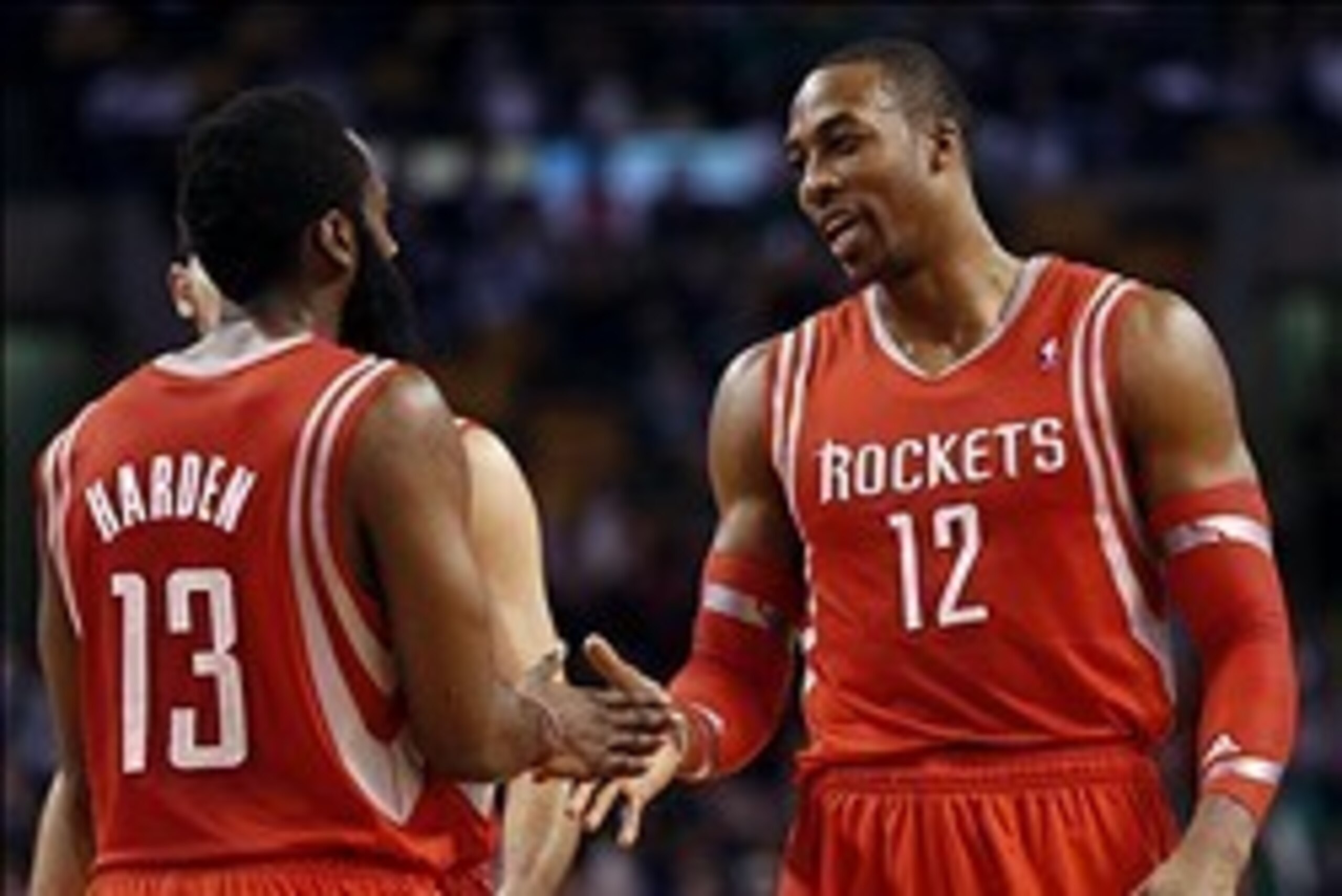 Jan 13, 2014; Boston, MA, USA; Houston Rockets power forward Dwight Howard (12) talks with shooting guard James Harden (13) during the second half of Houston's 104-92 win over the Boston Celtics at TD Garden. Mandatory Credit: Winslow Townson-USA TODAY Sp