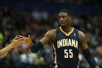 Mar 9, 2014; Dallas, TX, USA; Indiana Pacers center Roy Hibbert (55) celebrates after making a basket and getting fouled in the second quarter against the Dallas Mavericks at American Airlines Center. Mandatory Credit: Matthew Emmons-USA TODAY Sports