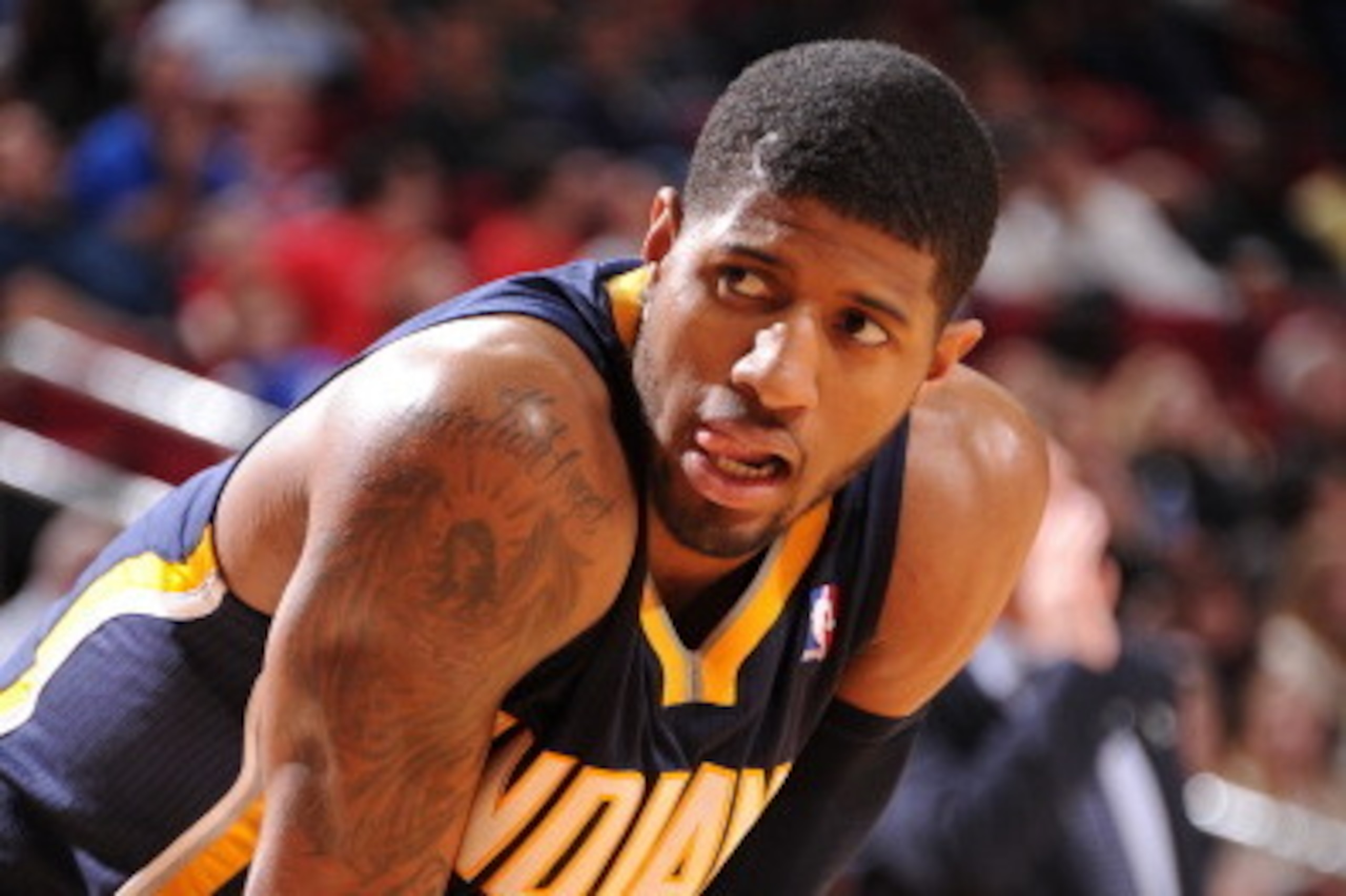 HOUSTON, TX - MARCH 7:  Paul George #24 of the Indiana Pacers reacts to a play against the Houston Rockets on March 7, 2014 at the Toyota Center in Houston, Texas. NOTE TO USER: User expressly acknowledges and agrees that, by downloading and or using this