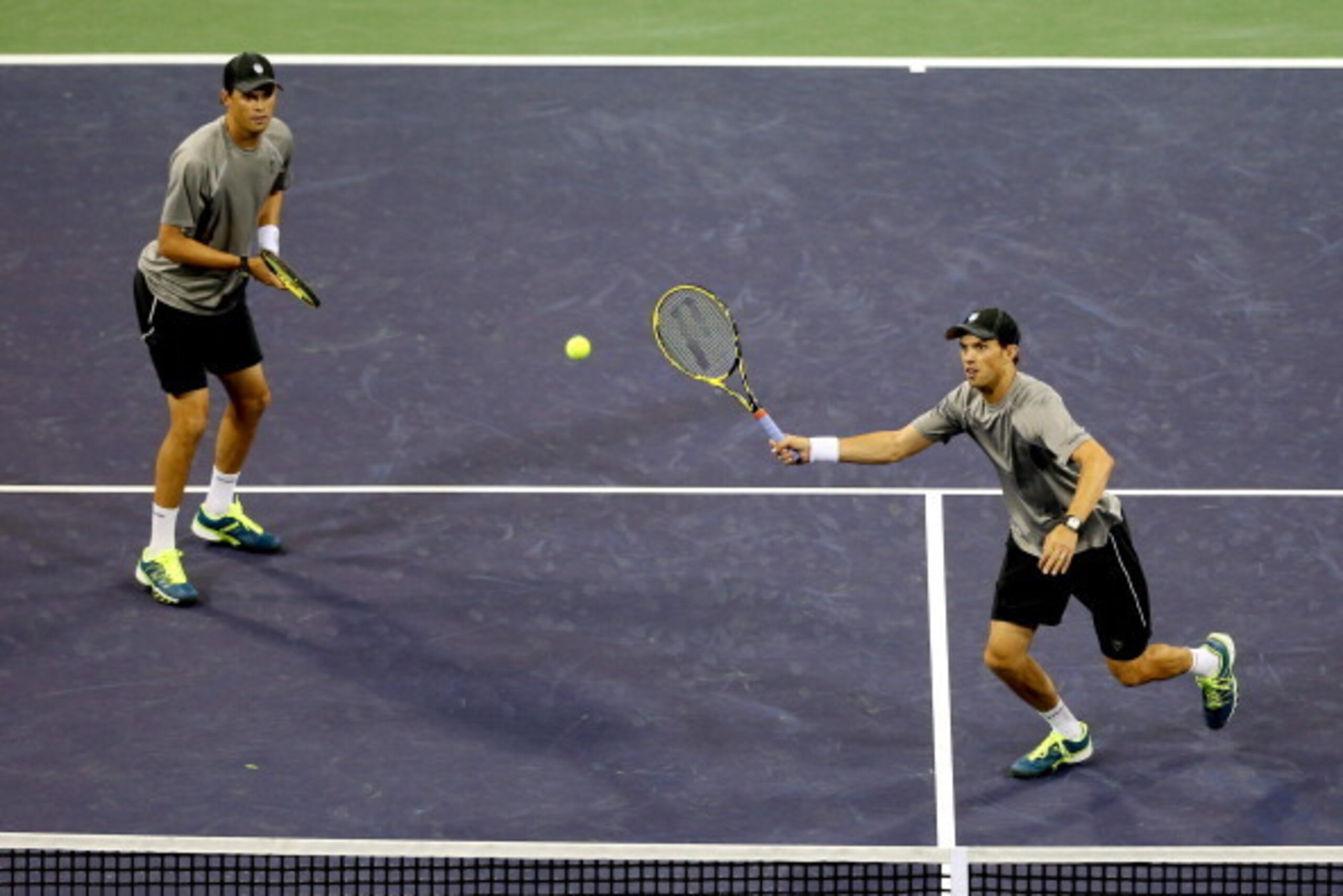 INDIAN WELLS, CA - MARCH 08:  Bob and Mike Bryan play Scott Lipsky and Florian Mayer of Germany during the BNP Parabas Open at the Indian Wells Tennis Garden on March 8, 2014 in Indian Wells, California.  (Photo by Matthew Stockman/Getty Images)