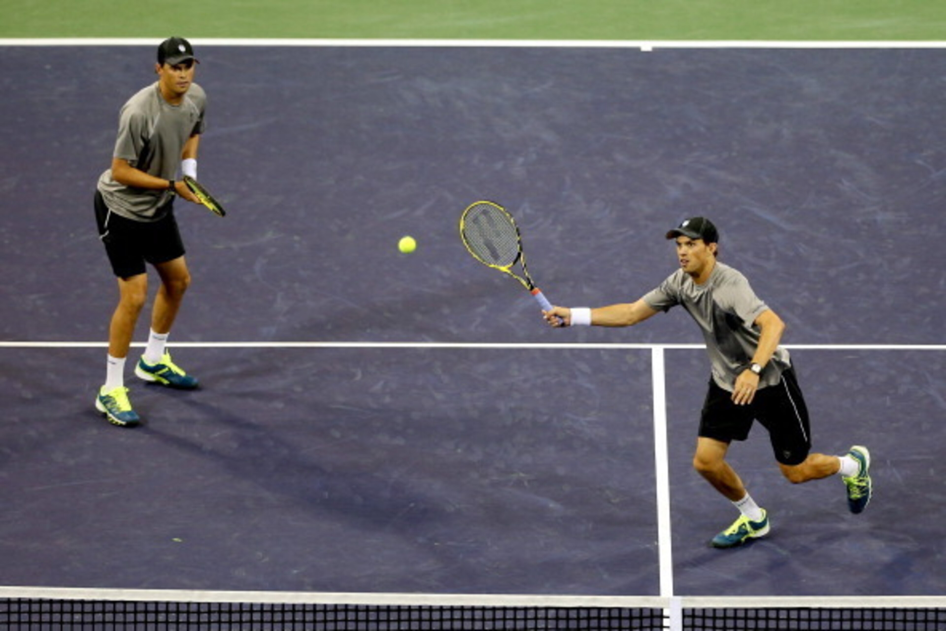 INDIAN WELLS, CA - MARCH 08:  Bob and Mike Bryan play Scott Lipsky and Florian Mayer of Germany during the BNP Parabas Open at the Indian Wells Tennis Garden on March 8, 2014 in Indian Wells, California.  (Photo by Matthew Stockman/Getty Images)