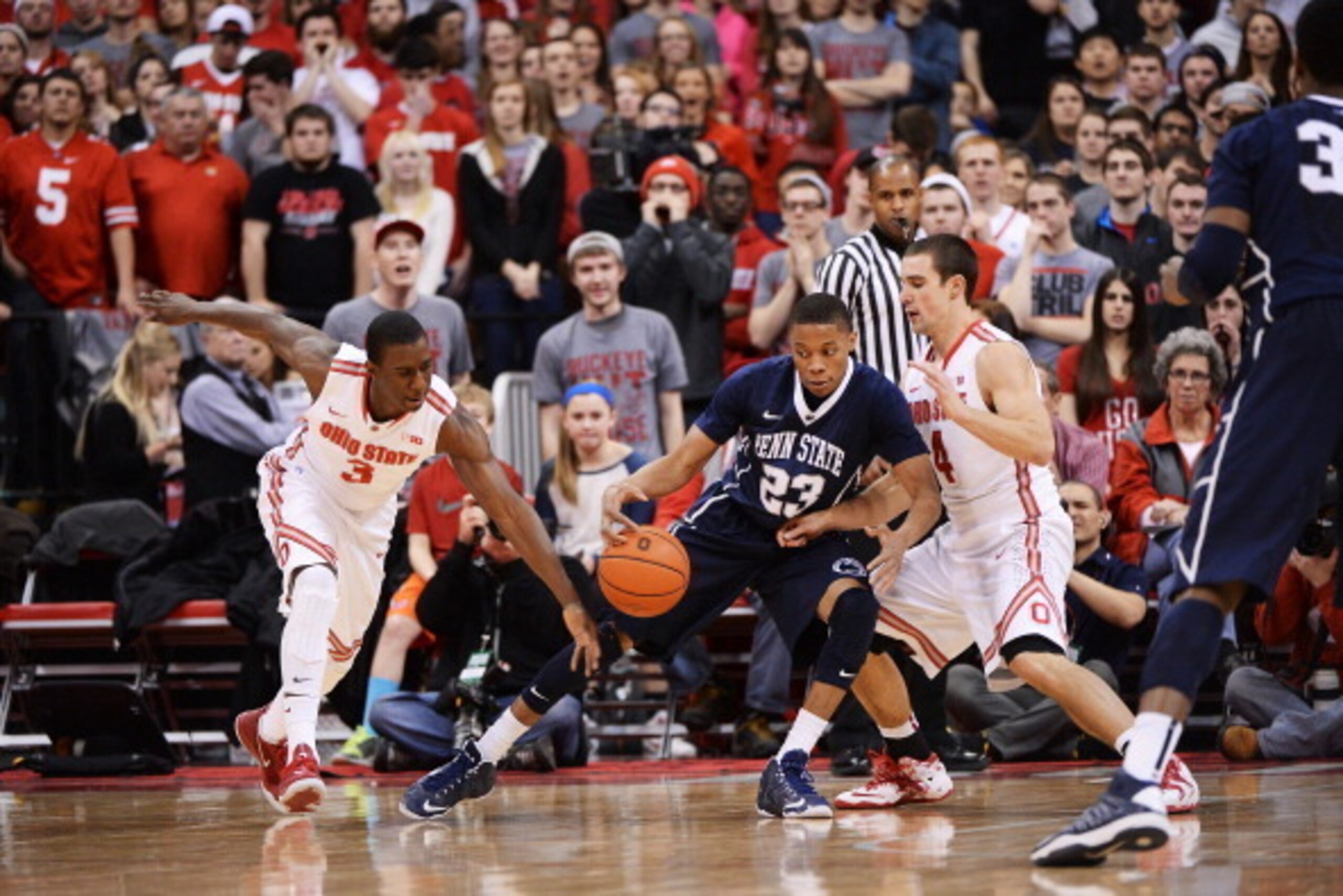 COLUMBUS, OH - JANUARY 29:  Tim Frazier #23 of the Penn State Nittany Lions loses control of the ball to Shannon Scott #3 of the Ohio State Buckeyes as Aaron Craft #4 of the Buckeyes defends in the second half on January 29, 2014 at Value City Arena in Co