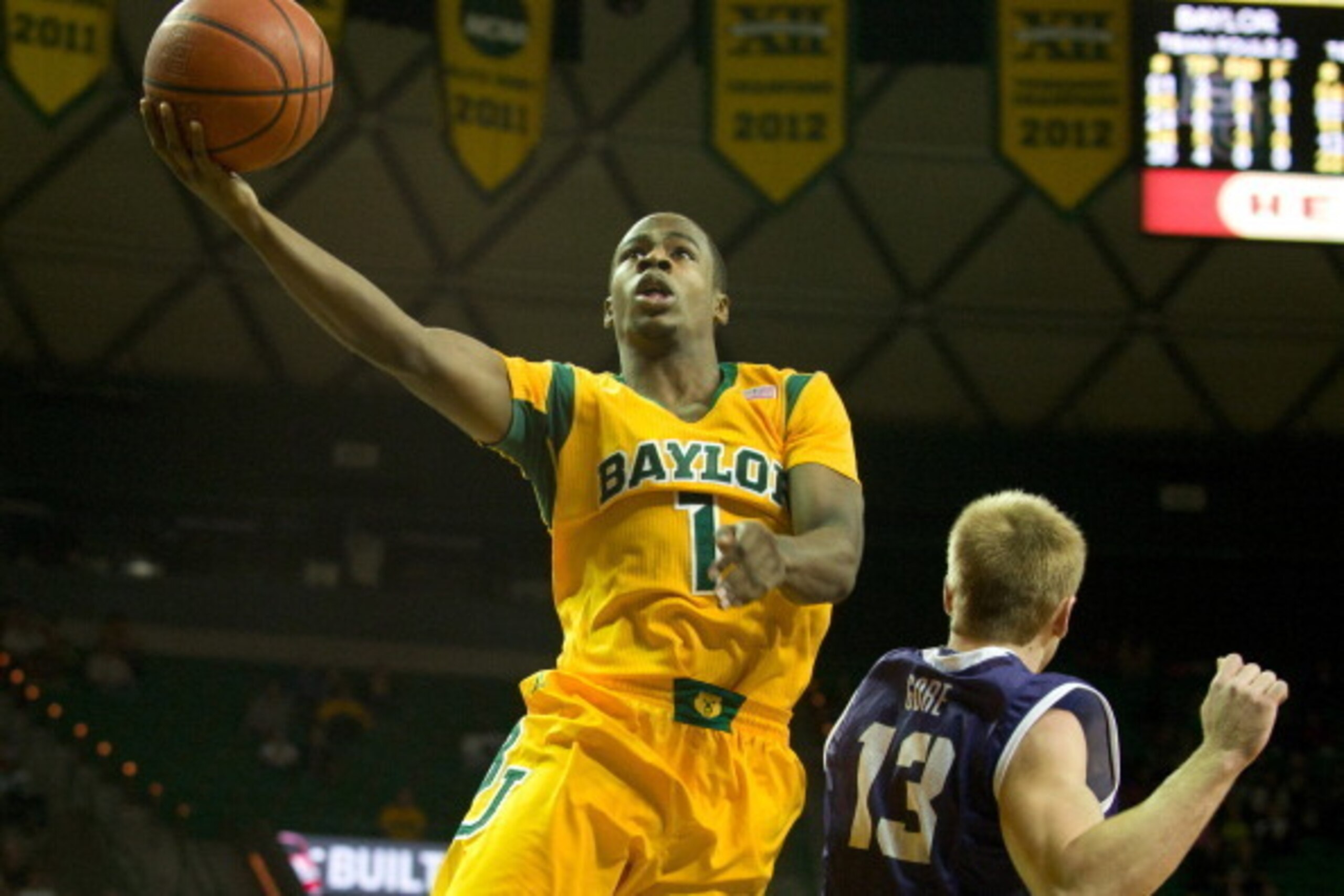WACO, TX - JANUARY 11: Kenny Chery #1 of the Baylor Bears drives to the basket past Christian Gore #13 of the TCU Horned Frogs on January 11, 2014 at the Ferrell Center in Waco, Texas.  (Photo by Cooper Neill/Getty Images)
