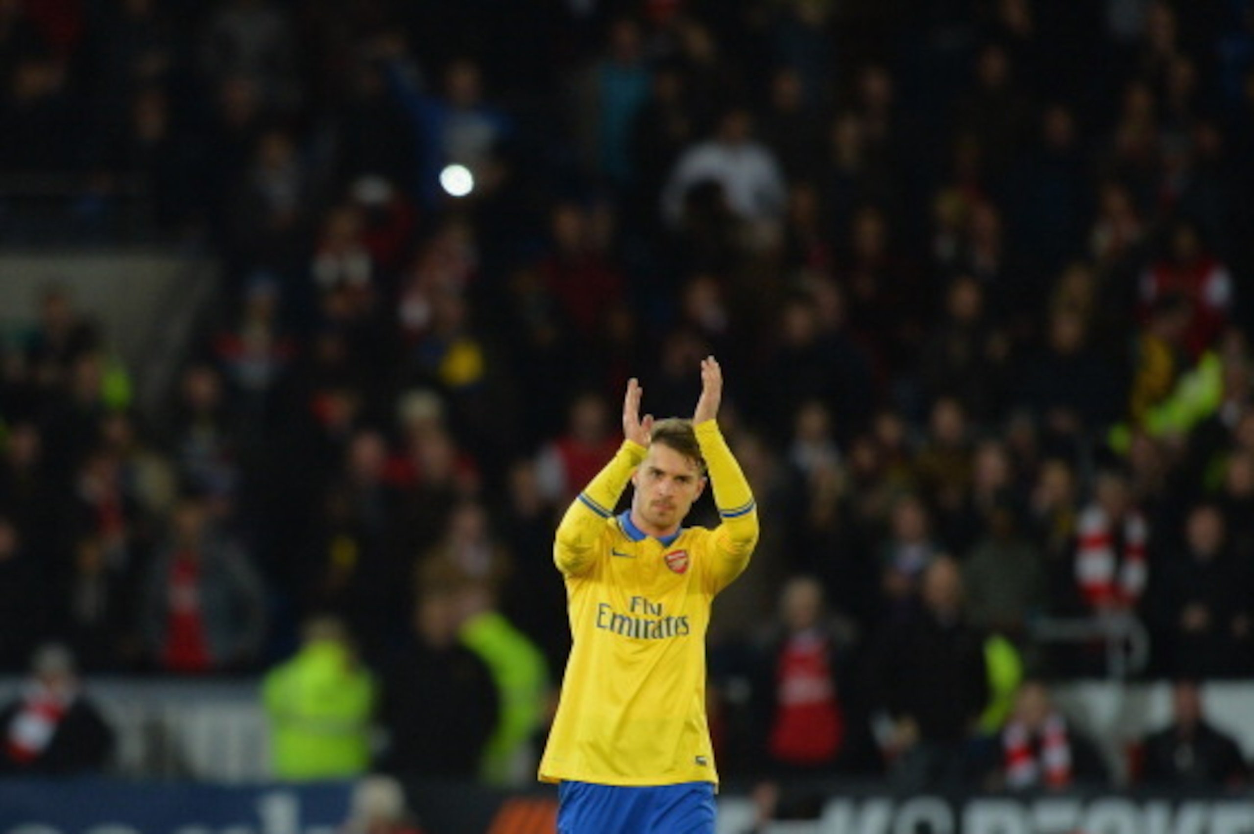 CARDIFF, WALES - NOVEMBER 30:  Aaron Ramsey of Arsenal appaulds both sets of fans after the match during the Barclays Premier League match between Cardiff City and Arsenal at Cardiff City Stadium on November 30, 2013 in Cardiff, Wales.  (Photo by Christop