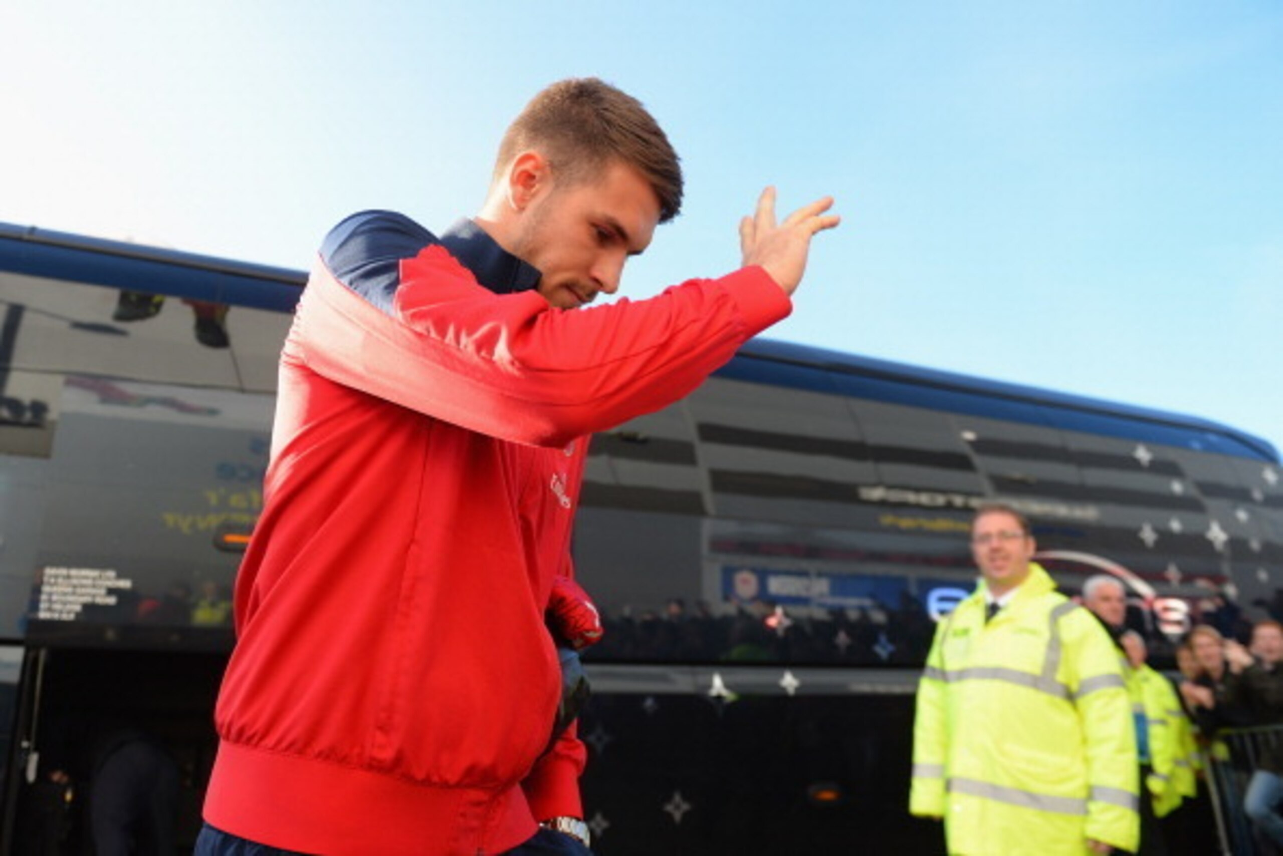 CARDIFF, WALES - NOVEMBER 30:  Aaron Ramsey of Arsenal acknowledges the fans as he arrives at Cardiff City during the Barclays Premier League match between Cardiff City and Arsenal at Cardiff City Stadium on November 30, 2013 in Cardiff, Wales.  (Photo by