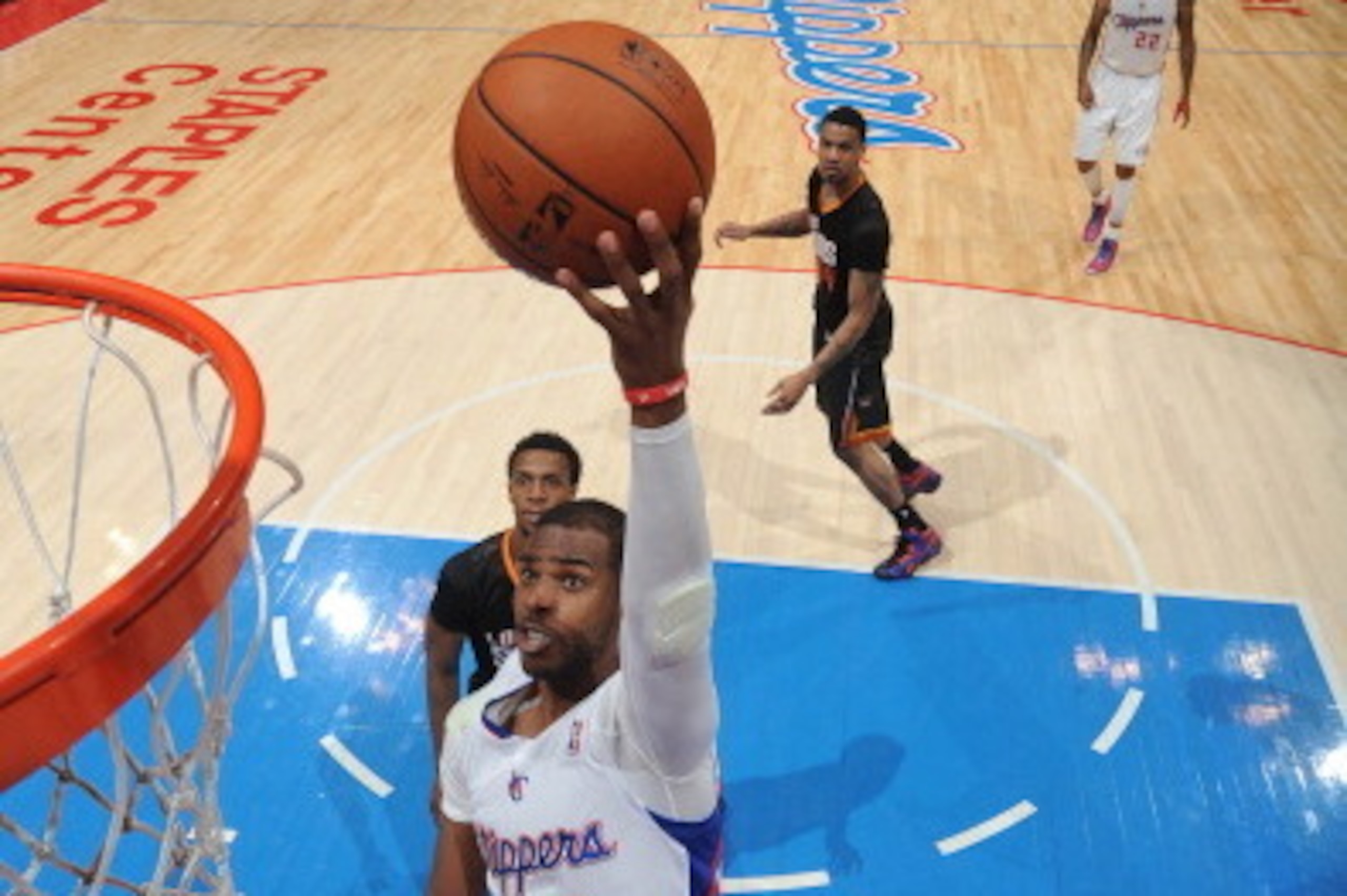 LOS ANGELES, CA - MARCH 10: Chris Paul #3 of the Los Angeles Clippers goes up for a shot against the Phoenix Suns at Staples Center on March 10, 2014 in Los Angeles, California. NOTE TO USER: User expressly acknowledges and agrees that, by downloading and