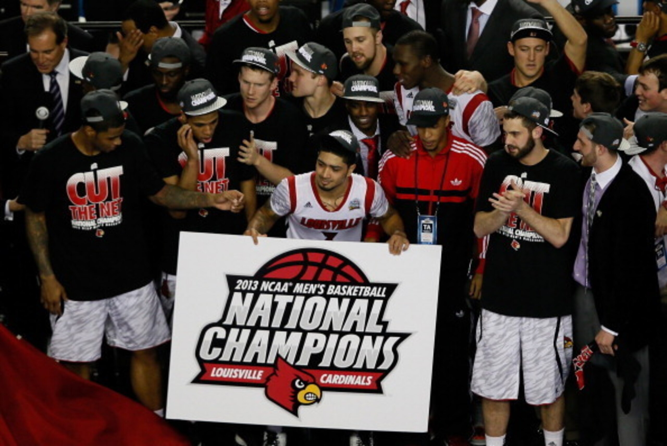 ATLANTA, GA - APRIL 08:  Peyton Siva (C) #3 of the Louisville Cardinals celebrates with his teammates after they won 82-76 against the Michigan Wolverines during the 2013 NCAA Men's Final Four Championship at the Georgia Dome on April 8, 2013 in Atlanta, 