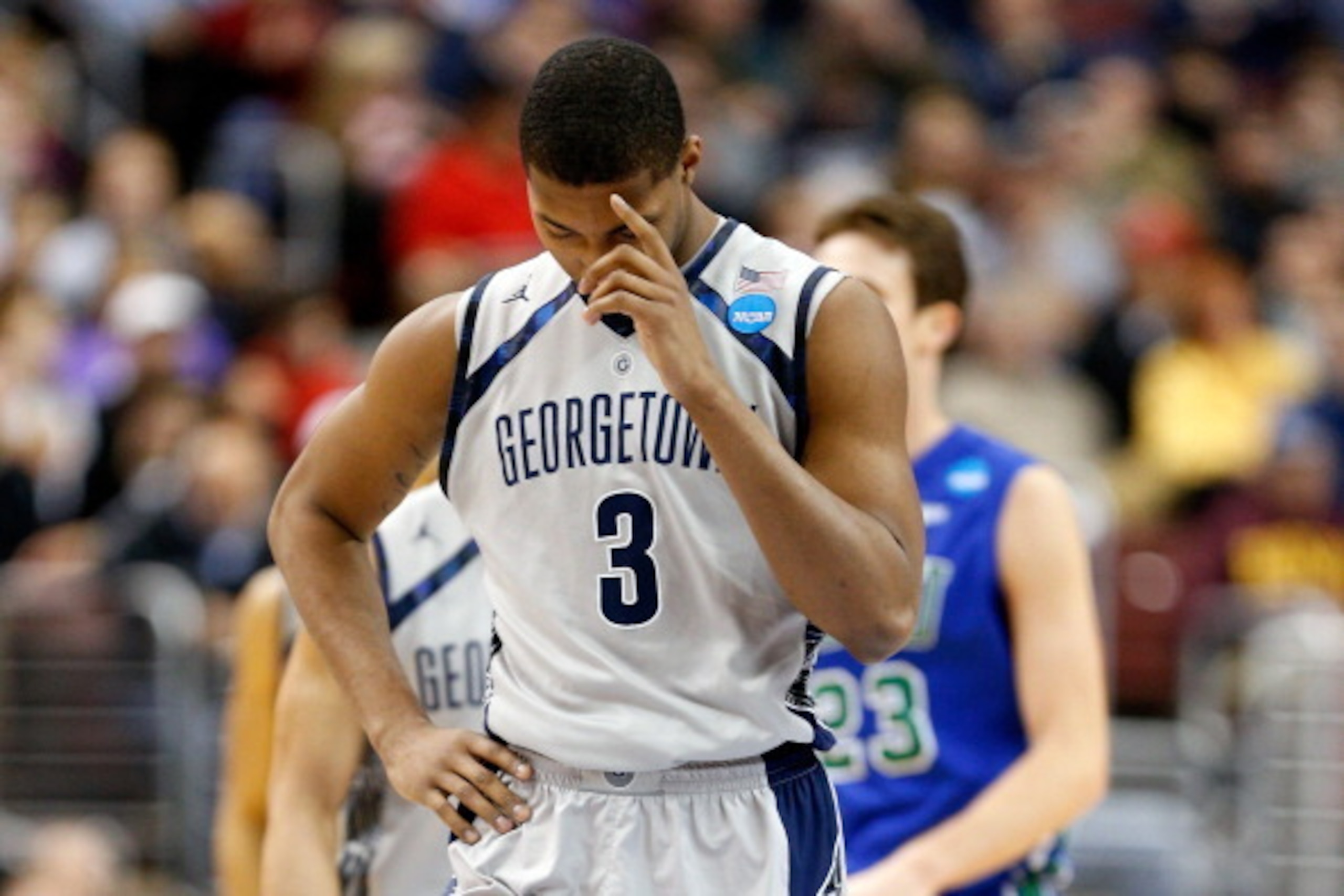 PHILADELPHIA, PA - MARCH 22:  Mikael Hopkins #3 of the Georgetown Hoyas stands on the court in the second half with his head down agaist the Florida Gulf Coast Eagles during the second round of the 2013 NCAA Men's Basketball Tournament at Wells Fargo Cent