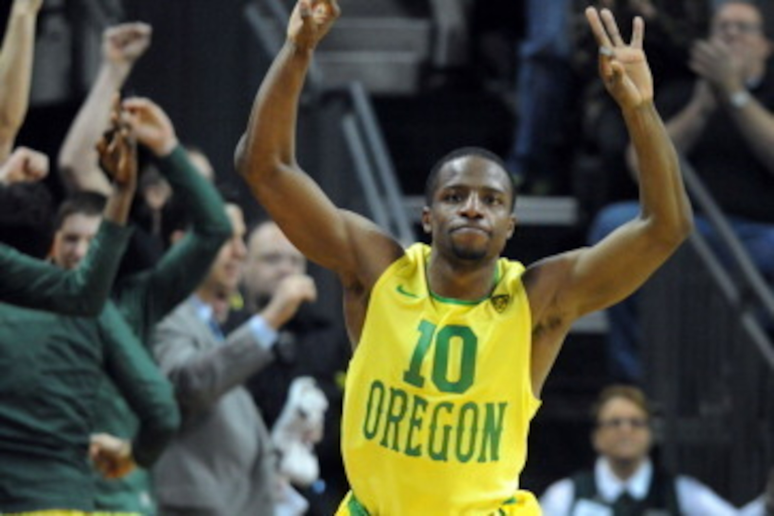 EUGENE, OR - MARCH 8: Johnathan Loyd #10 of the Oregon Ducks reacts after hitting a key three point shot  during the second half of the game against the Arizona Wildcats at Matthew Knight Arena on March 8, 2014 in Eugene, Oregon. Oregon won the game 64-57