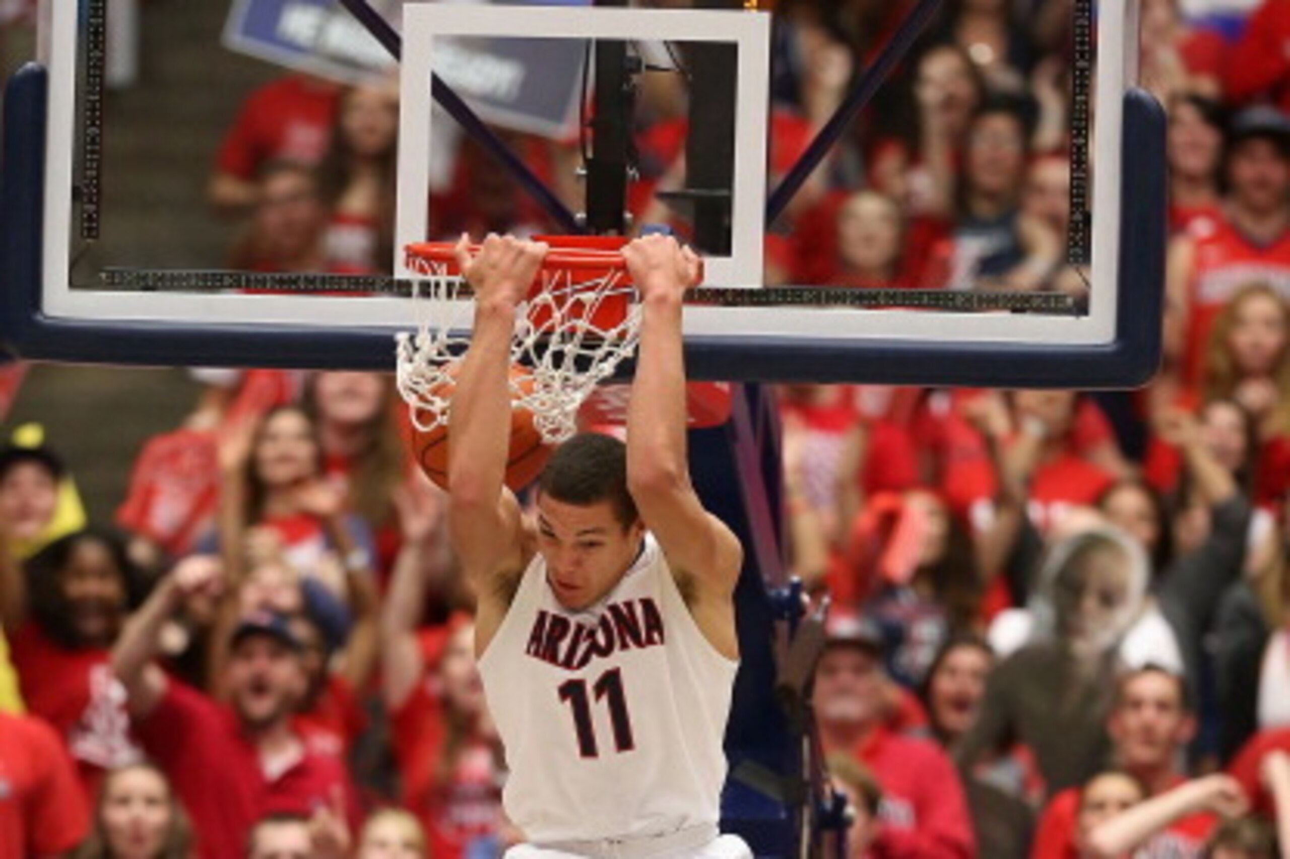 TUCSON, AZ - FEBRUARY 26:  Aaron Gordon #11 of the Arizona Wildcats slam dunks against the California Golden Bears during the first half of the college basketball game at McKale Center on February 26, 2014 in Tucson, Arizona.  (Photo by Christian Petersen