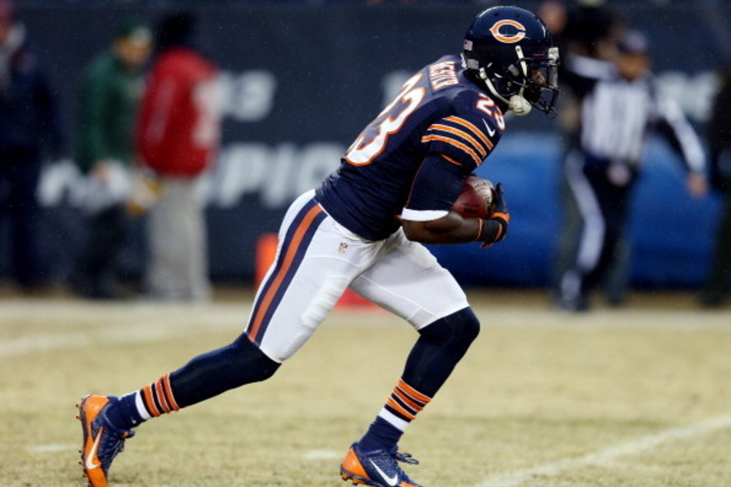 CHICAGO, IL - DECEMBER 29: Wide receiver Devin Hester #23 of the Chicago Bears runs with the ball against the Green Bay Packers during a game at Soldier Field on December 29, 2013 in Chicago, Illinois.  (Photo by Jonathan Daniel/Getty Images)