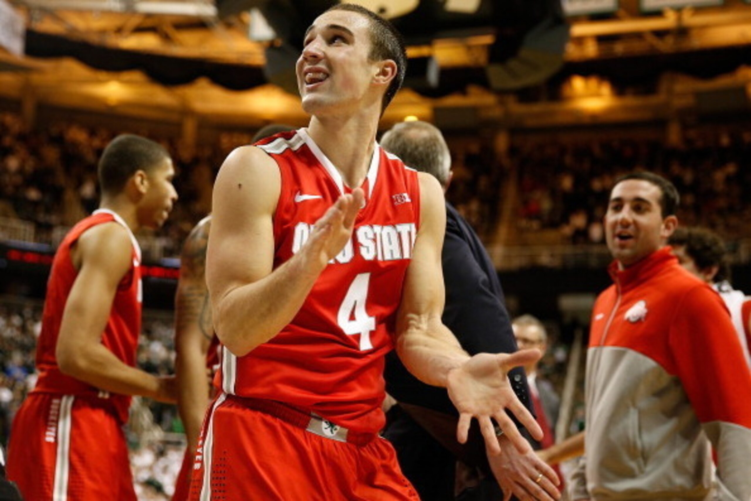 EAST LANSING, MI - JANUARY 07:  Aaron Craft #4 of the Ohio State Buckeyes reacts late in the second half after tying the game while playing the Michigan State Spartans at the Jack T. Breslin Student Events Center on January 7, 2014 in East Lansing, Michig