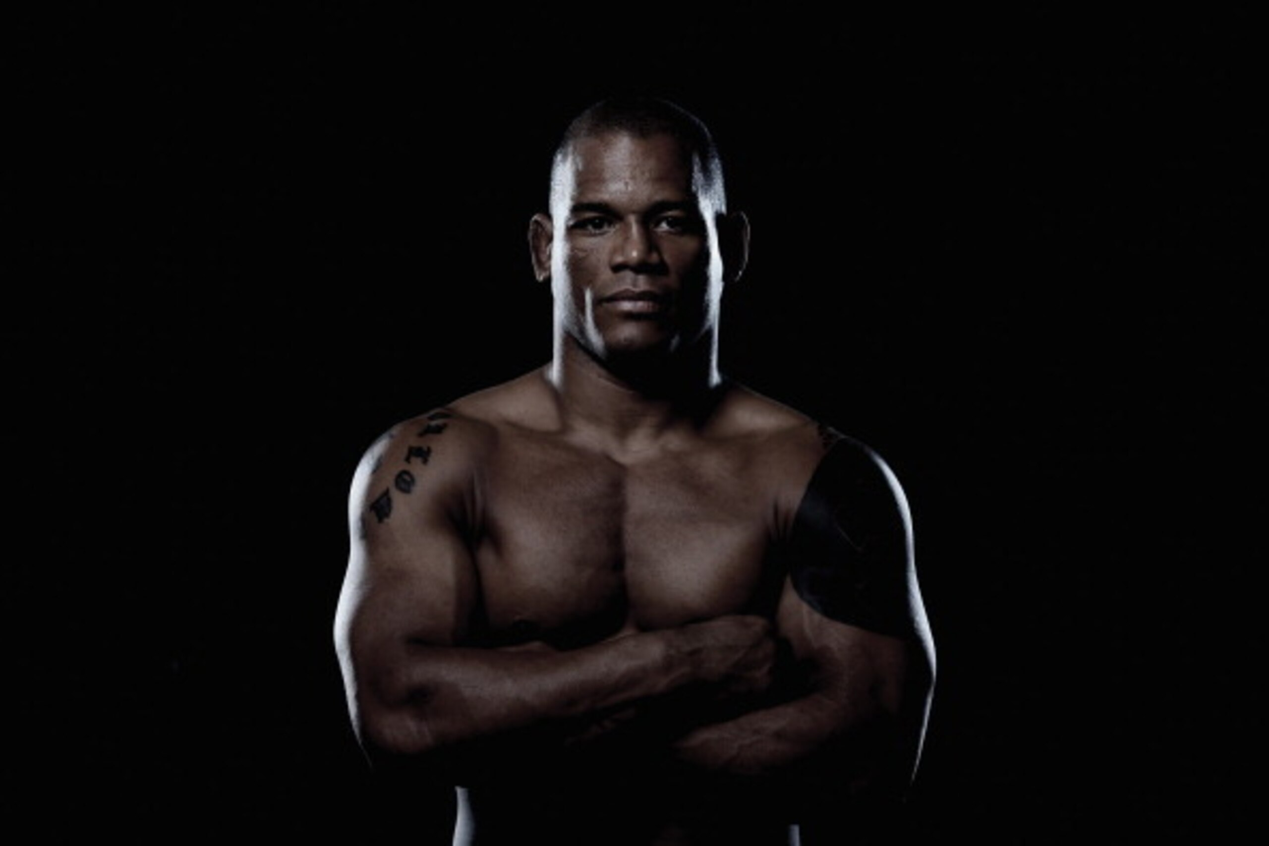 BRISBANE, AUSTRALIA - DECEMBER 06:  (EDITORS NOTE: Image has been desaturated) Hector Lombard poses during a UFC portrait session on December 6, 2013 in Brisbane, Australia.  (Photo by Chris Hyde/Getty Images)