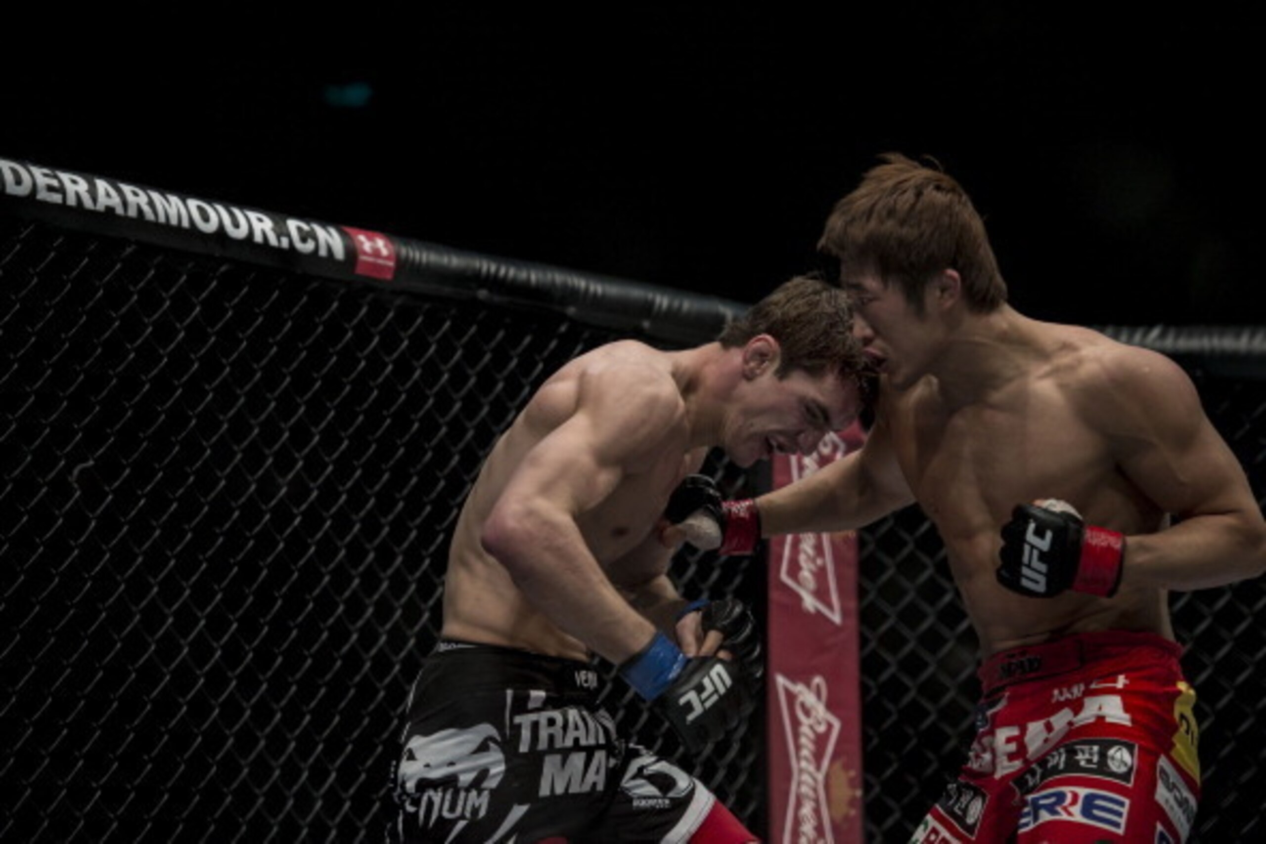 MACAU - MARCH 01:  Dong Hyun Kim (R) of South Korea and John Hathaway (L) of England fight in their welterweight bout during the UFC Fight Night at the Cotai Arena on March 1, 2014 in Macau, China.  (Photo by Victor Fraile/Getty Images)