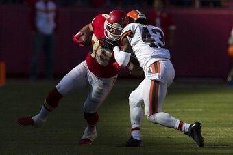 KANSAS CITY, MO - OCTOBER 27: Tight end Anthony Fasano #80 of the Kansas City Chiefs collides with strong safety T.J. Ward #43 of the Cleveland Browns during the game at Arrowhead Stadium on October 27, 2013 in Kansas City, Missouri. (Photo by David Welke