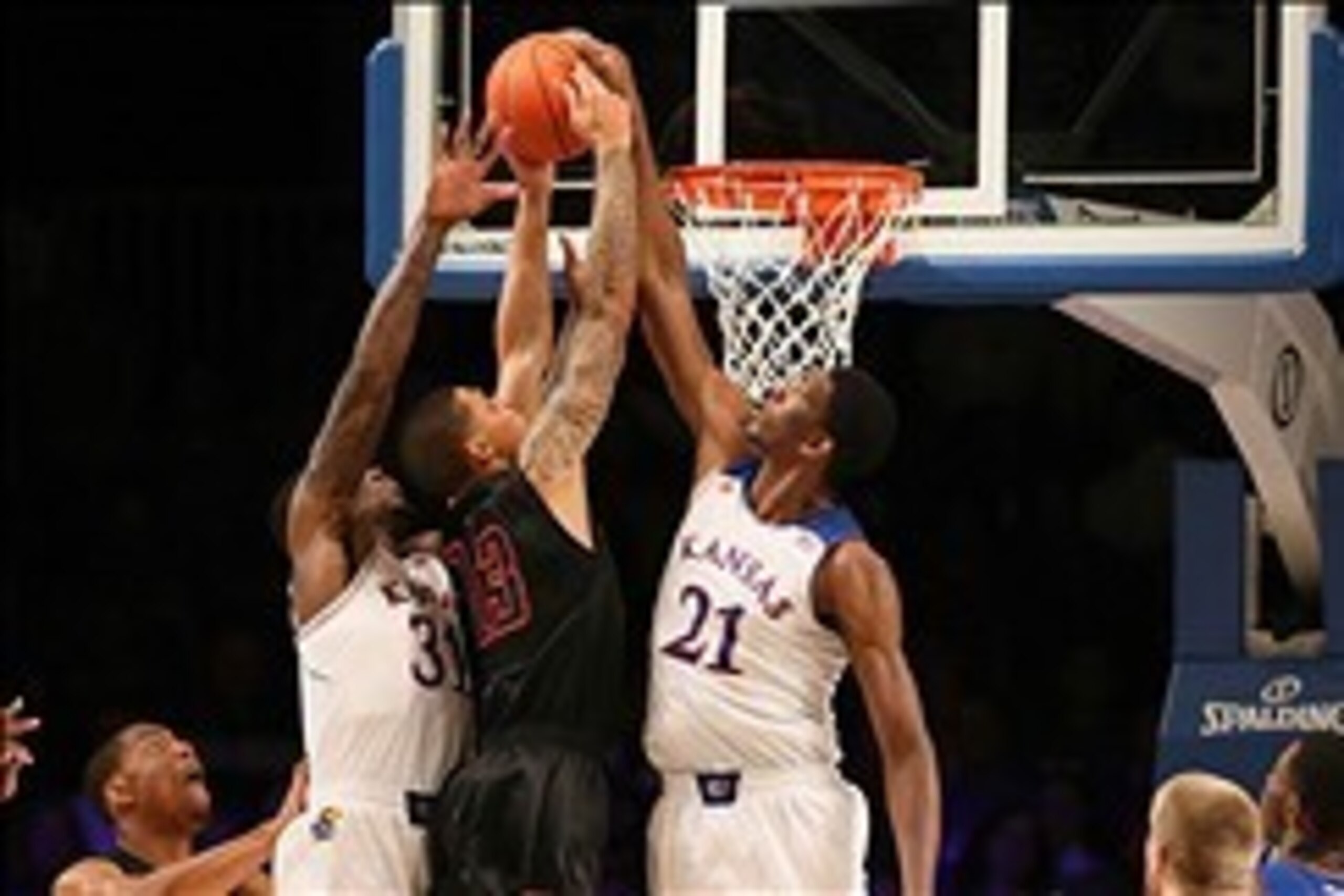 Nov 30, 2013; Paradise Island, BAHAMAS; Kansas Jayhawks center Joel Embiid (21) blocks the shot of UTEP Miners guard McKenzie Moore (13) during the game at the 2013 Battle 4 Atlantis in the Imperial Arena at the Atlantis Resort. Mandatory Credit: Kevin Ja