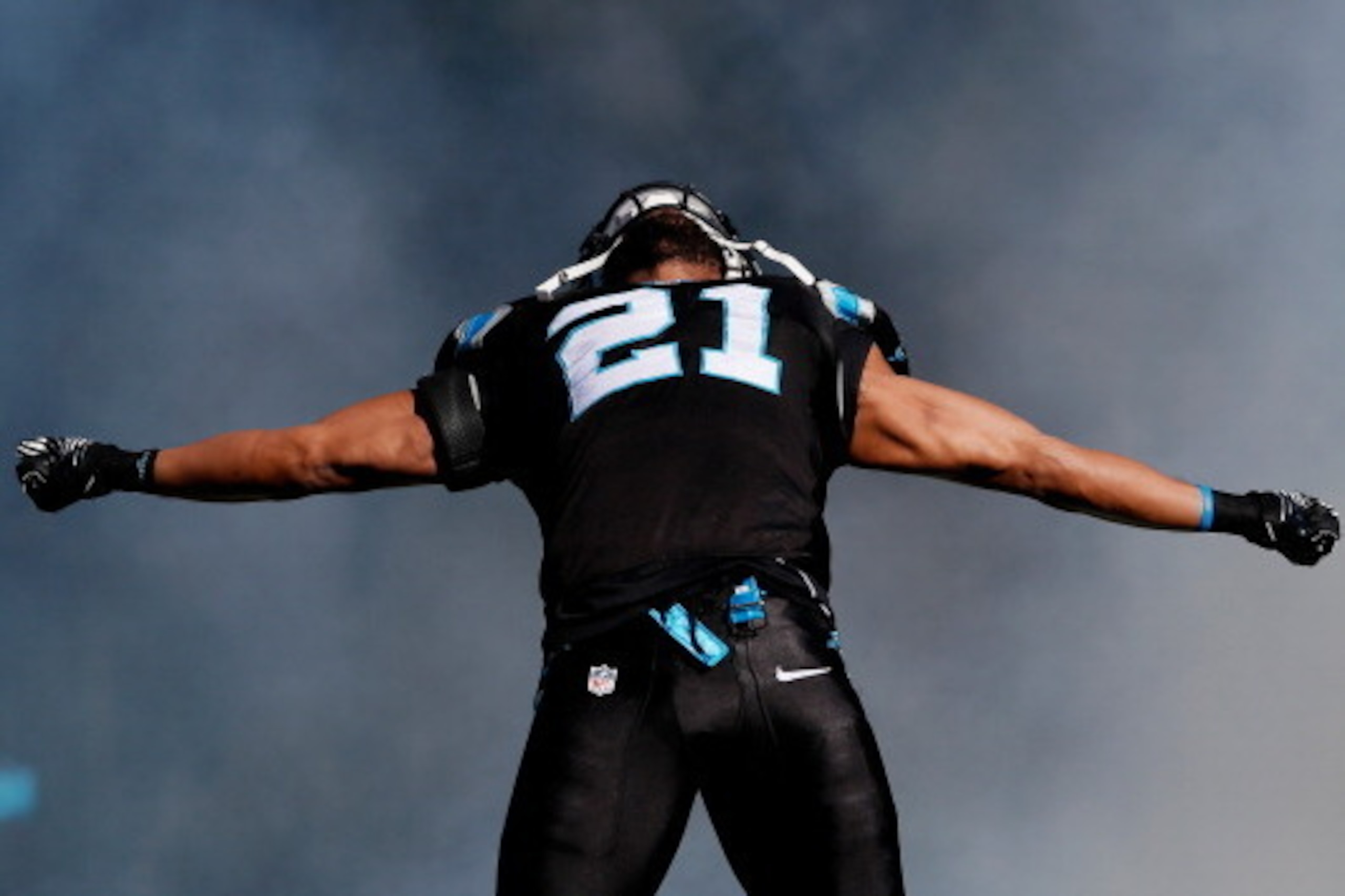 CHARLOTTE, NC - JANUARY 12:  Mike Mitchell #21 of the Carolina Panthers runs onto the field during player introductions against the San Francisco 49ers during the NFC Divisional Playoff Game at Bank of America Stadium on January 12, 2014 in Charlotte, Nor