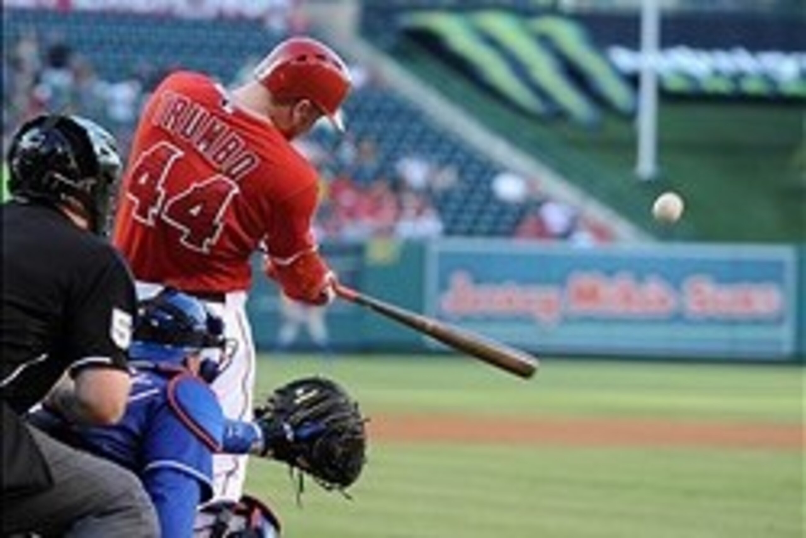 Sep 7, 2013; Anaheim, CA, USA; Los Angeles Angels first baseman Mark Trumbo (44) hits a two-run home run against the Texas Rangers in the first inning of the game at Angel Stadium of Anaheim. Mandatory Credit: Jayne Kamin-Oncea-USA TODAY Sports Sep 7, 2013; Anaheim, CA, USA; Los Angeles Angels first baseman Mark Trumbo (44) hits a two-run home run against the Texas Rangers in the first inning of the game at Angel Stadium of Anaheim. Mandatory Credit: Jayne Kamin-Oncea-USA TODAY Sports