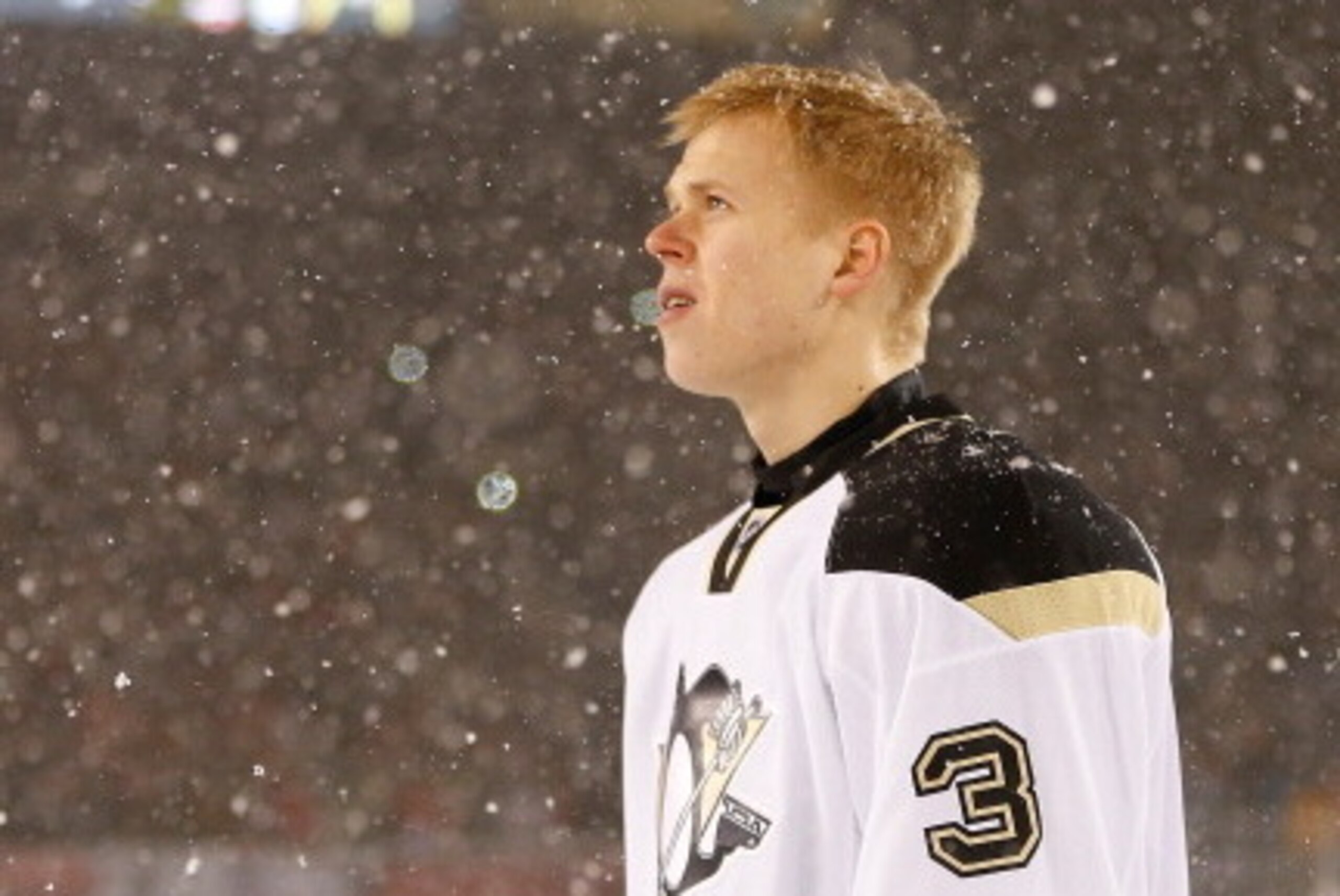 CHICAGO, IL - MARCH 1: (EDITORIAL USE ONLY) Olli Maatta #3 of the Pittsburgh Penguins looks on during the National Anthem prior to the 2014 NHL Stadium Series game against the Chicago Blackhawks on March 1, 2014 at Soldier Field in Chicago, Illinois.  (Ph