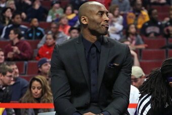 CHICAGO, IL - JANUARY 20: Kobe Bryant #24 of the Los Angeles Lakers watches from the bench as his teammates take on the Chicago Bulls at the United Center on January 20, 2014 in Chicago, Illinois. NOTE TO USER: User expressly acknowledges and agrees that,