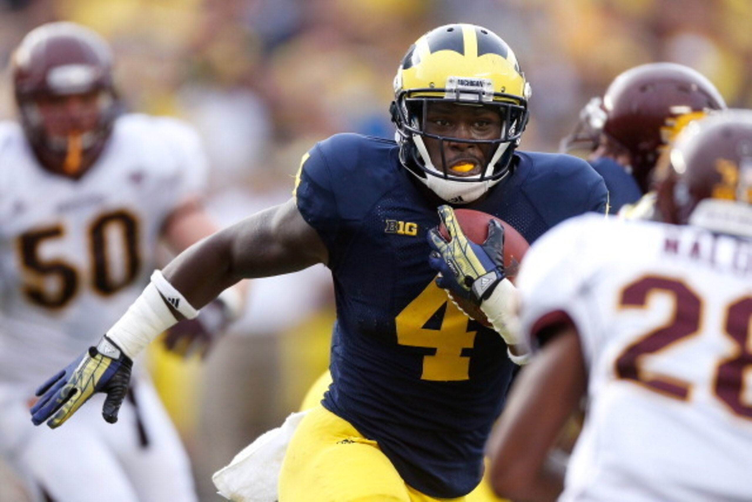 ANN ARBOR, MI - AUGUST 31: De'Veon Smith #4 of the Michigan Wolverines looks for extra yards during a fourth quarter run while playing the Central Michigan Chippewas at Michigan Stadium on August 31, 2013 in Ann Arbor, Michigan. Michigan won the 59-9. (Ph ANN ARBOR, MI - AUGUST 31: De'Veon Smith #4 of the Michigan Wolverines looks for extra yards during a fourth quarter run while playing the Central Michigan Chippewas at Michigan Stadium on August 31, 2013 in Ann Arbor, Michigan. Michigan won the 59-9. (Ph