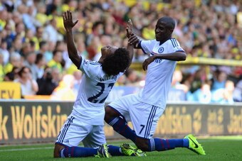 NORWICH, ENGLAND - OCTOBER 06:  Willian of Chelsea celebrates scoring their third goal with Ramires of Chelsea during the Barclays Premier League match between Norwich City and Chelsea at Carrow Road on October 6, 2013 in Norwich, England.  (Photo by Jami