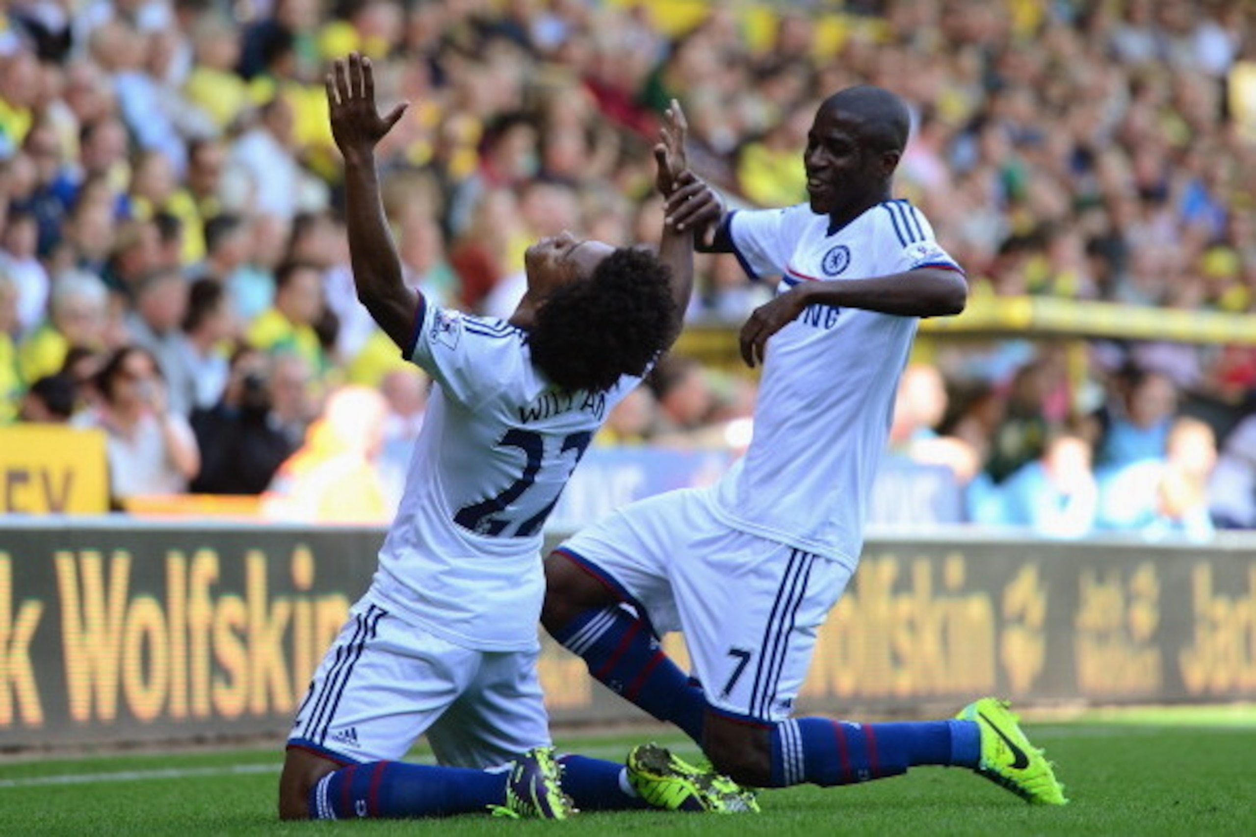 NORWICH, ENGLAND - OCTOBER 06:  Willian of Chelsea celebrates scoring their third goal with Ramires of Chelsea during the Barclays Premier League match between Norwich City and Chelsea at Carrow Road on October 6, 2013 in Norwich, England.  (Photo by Jami
