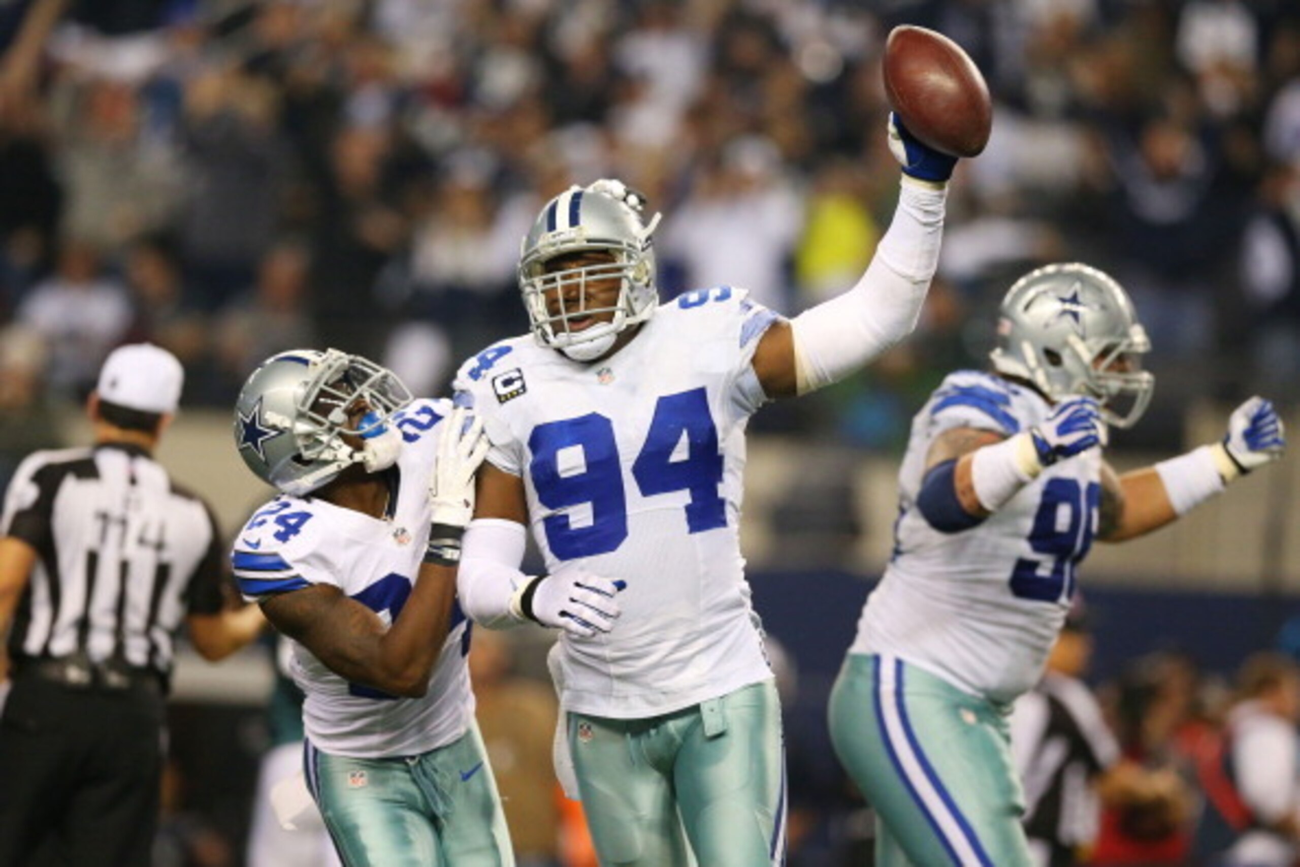 ARLINGTON, TX - DECEMBER 29:  DeMarcus Ware #94 and Morris Claiborne #24 of the Dallas Cowboys celebrate a fumble recovery in the second half against the Philadelphia Eagles at Cowboys Stadium on December 29, 2013 in Arlington, Texas.  (Photo by Ronald Ma