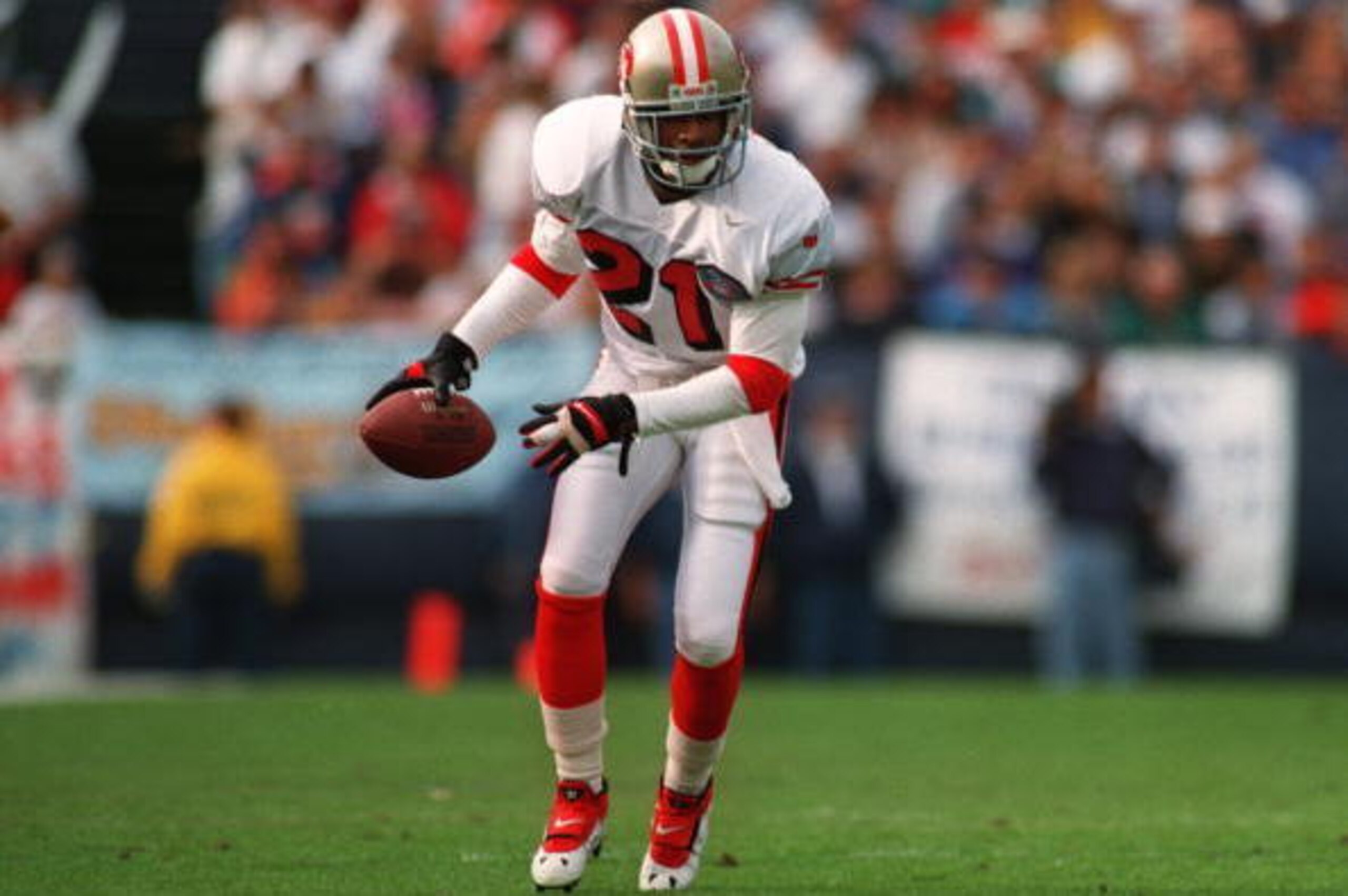 11 DEC 1994: SAN FRANCISCO 49ERS CORNERBACK DEION SANDERS HEADS DOWN FIELD AFTER PICKING UP A LOOSE FOOTBALL IN THE 49ERS 38-15 VICTORY OVER THE SAN DIEGO CHARGERS. THE BALL WAS RULES PREVIOUSLY DEAD. Mandatory Credit: Stephen Dunn/ALLSPORT