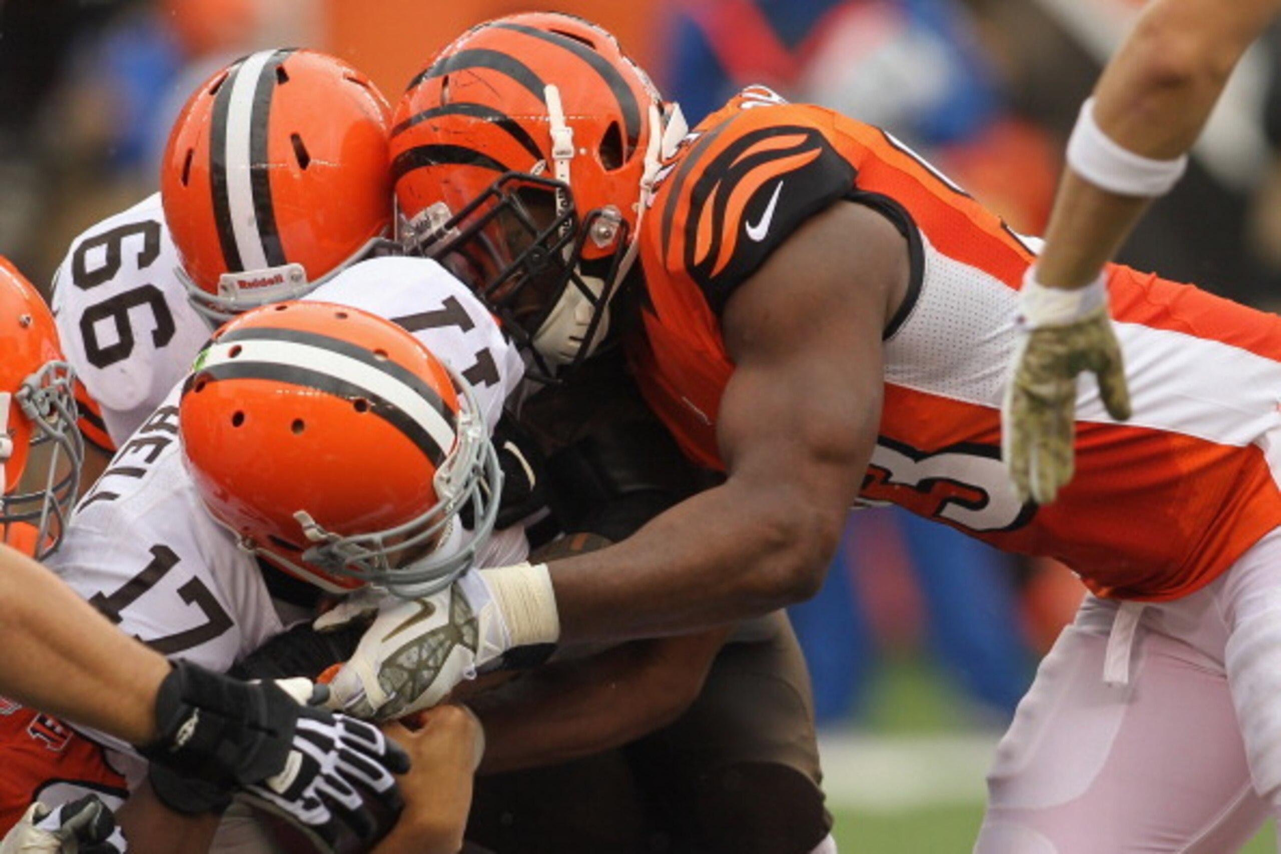 CINCINNATI, OH - NOVEMBER 17:  Michael Johnson #93 of the Cincinnati Bengals sacks Jason Campbell #17 of the Cleveland Browns during their game at Paul Brown Stadium on November 17, 2013 in Cincinnati, Ohio.  The Bengals defeated the Browns 41-20.  (Photo