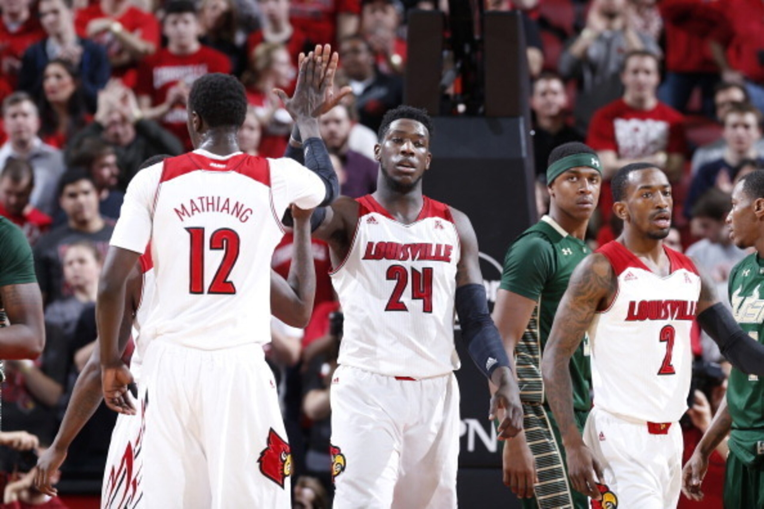 LOUISVILLE, KY - FEBRUARY 18: Montrezl Harrell #24 and Mangok Mathiang #12 of the Louisville Cardinals celebrate after a basket against the South Florida Bulls during the first half of the game at KFC Yum! Center on February 18, 2014 in Louisville, Kentuc LOUISVILLE, KY - FEBRUARY 18: Montrezl Harrell #24 and Mangok Mathiang #12 of the Louisville Cardinals celebrate after a basket against the South Florida Bulls during the first half of the game at KFC Yum! Center on February 18, 2014 in Louisville, Kentuc