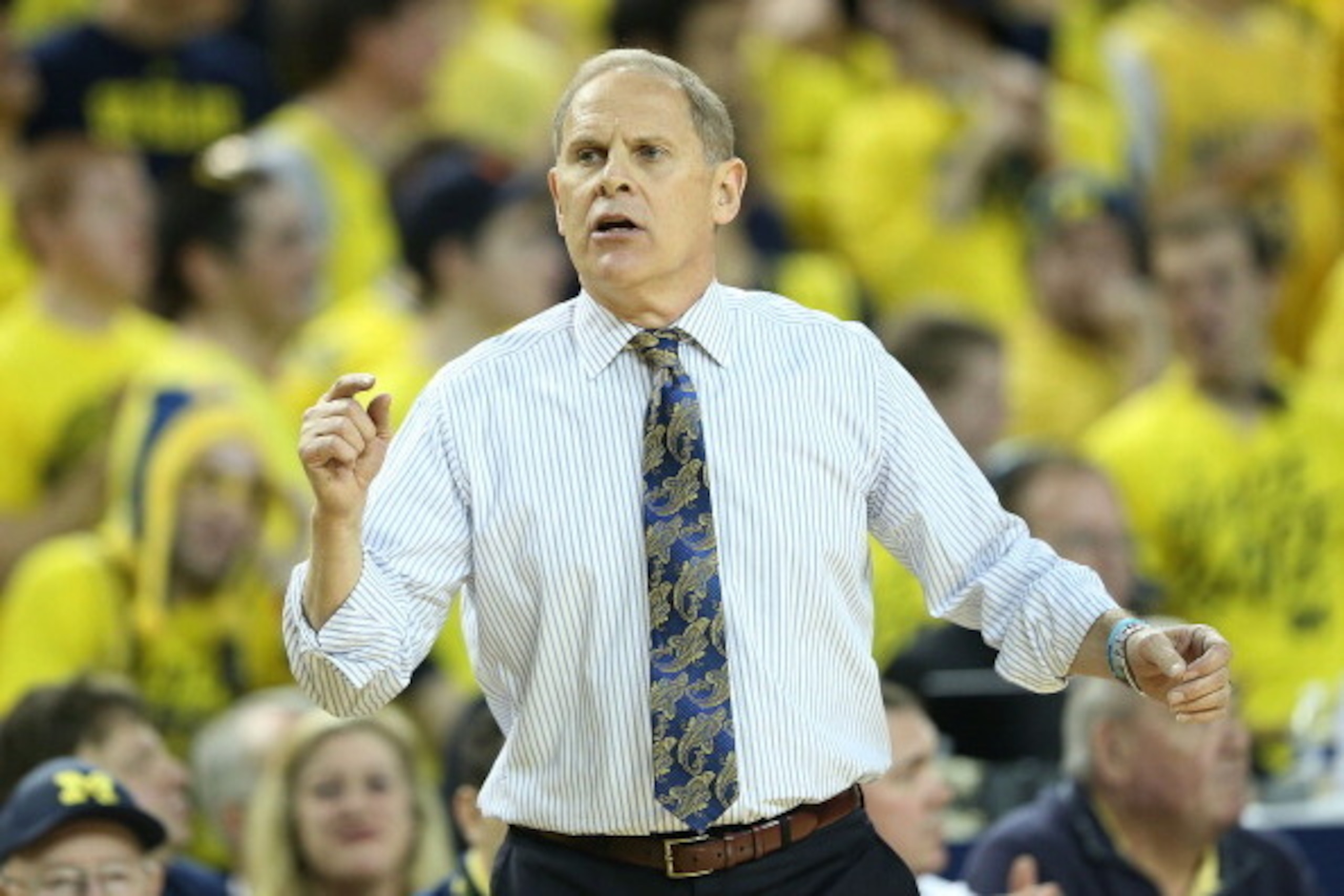 ANN ARBOR, MI - DECEMBER 14: Head coach John Beilein of the Michigan Wolverines shouts out instructions during the second half of the game against the Arizona Wildcats at Crisler Center on December 14, 2013 in Ann Arbor, Michigan. Arizona defeated Michiga