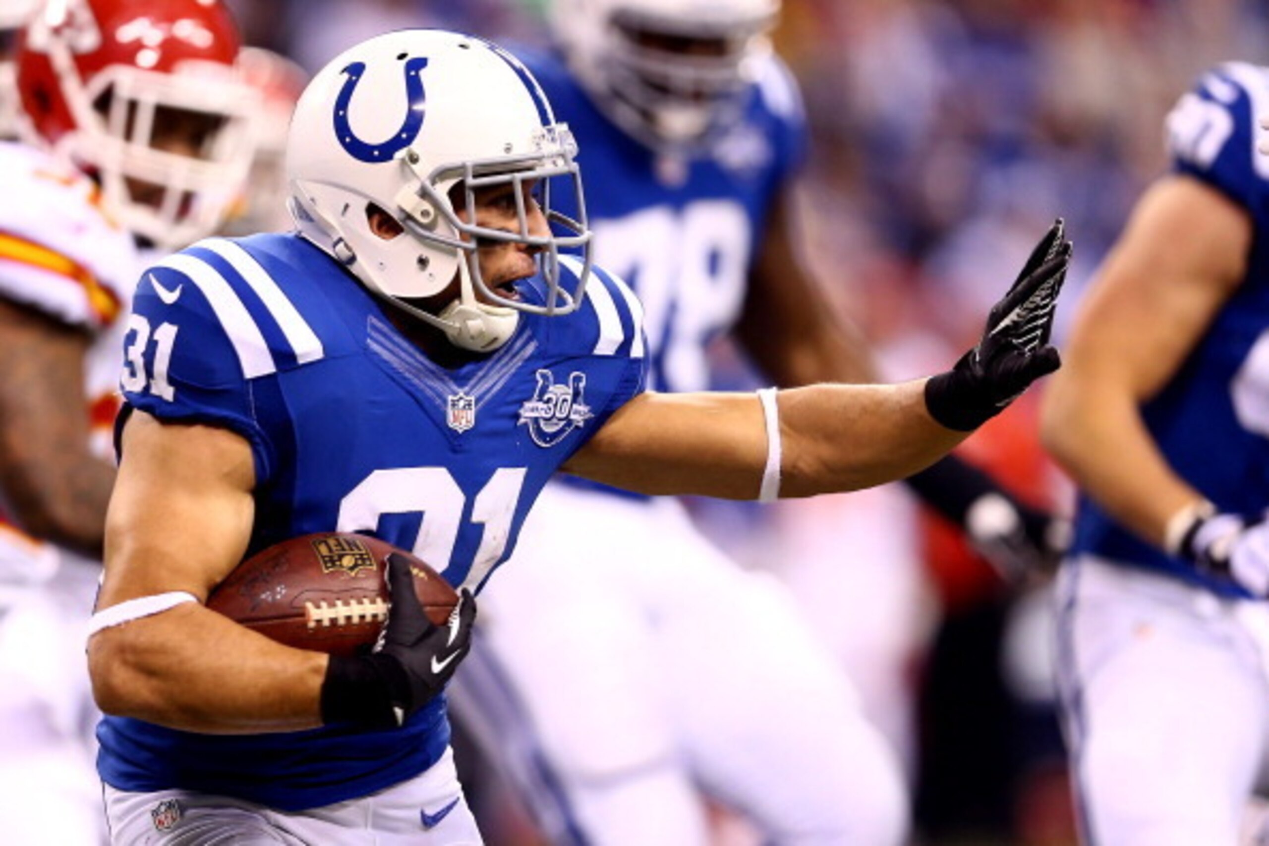 INDIANAPOLIS, IN - JANUARY 04: Running back Donald Brown #31 of the Indianapolis Colts carries the ball against the Kansas City Chiefs during a Wild Card Playoff game at Lucas Oil Stadium on January 4, 2014 in Indianapolis, Indiana.  (Photo by Andy Lyons/