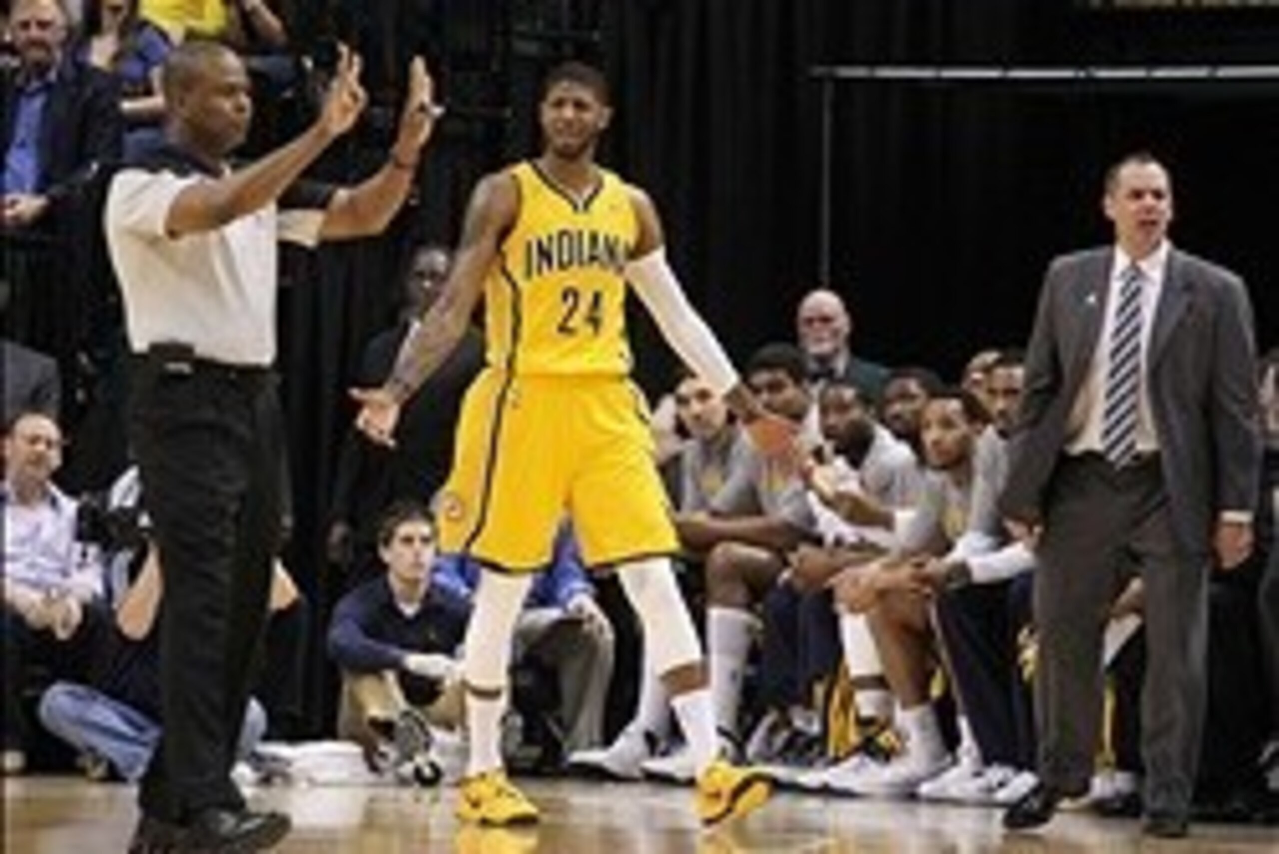 Mar 11, 2014; Indianapolis, IN, USA; Indiana Pacers forward Paul George (24) and coach Frank Vogel are upset over an offensive foul called against George during a game against the Boston Celtics at Bankers Life Fieldhouse. Mandatory Credit: Brian Spurlock