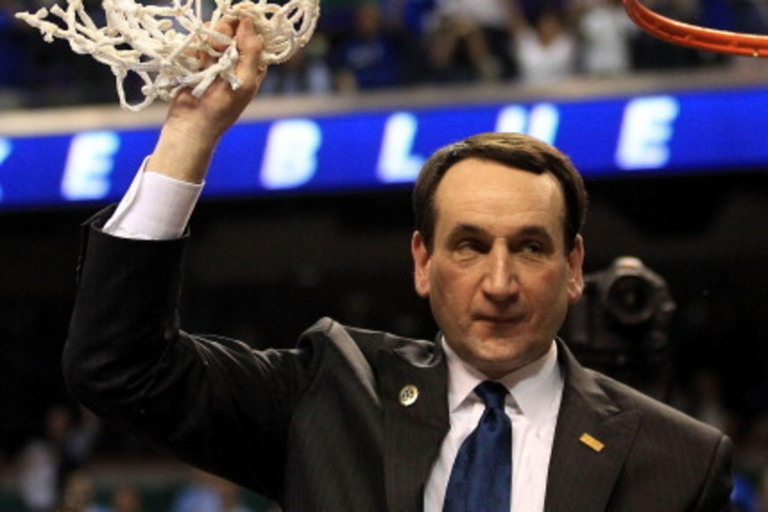 GREENSBORO, NC - MARCH 13: Head coach Mike Krzyzewski of the Duke Blue Devils cuts down the net after defeating the North Carolina Tar Heels 75-58 in the championship game of the 2011 ACC men's basketball tournament at the Greensboro Coliseum on March 13 GREENSBORO, NC - MARCH 13: Head coach Mike Krzyzewski of the Duke Blue Devils cuts down the net after defeating the North Carolina Tar Heels 75-58 in the championship game of the 2011 ACC men's basketball tournament at the Greensboro Coliseum on March 13