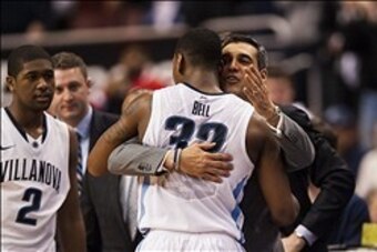 Mar 8, 2014; Villanova, PA, USA; Villanova Wildcats head coach Jay Wright hugs guard James Bell (32) as he takes him out of the game late in the second half against the Georgetown Hoyas at the Wells Fargo Center. Villanova defeated Georgetown 77-59. Manda