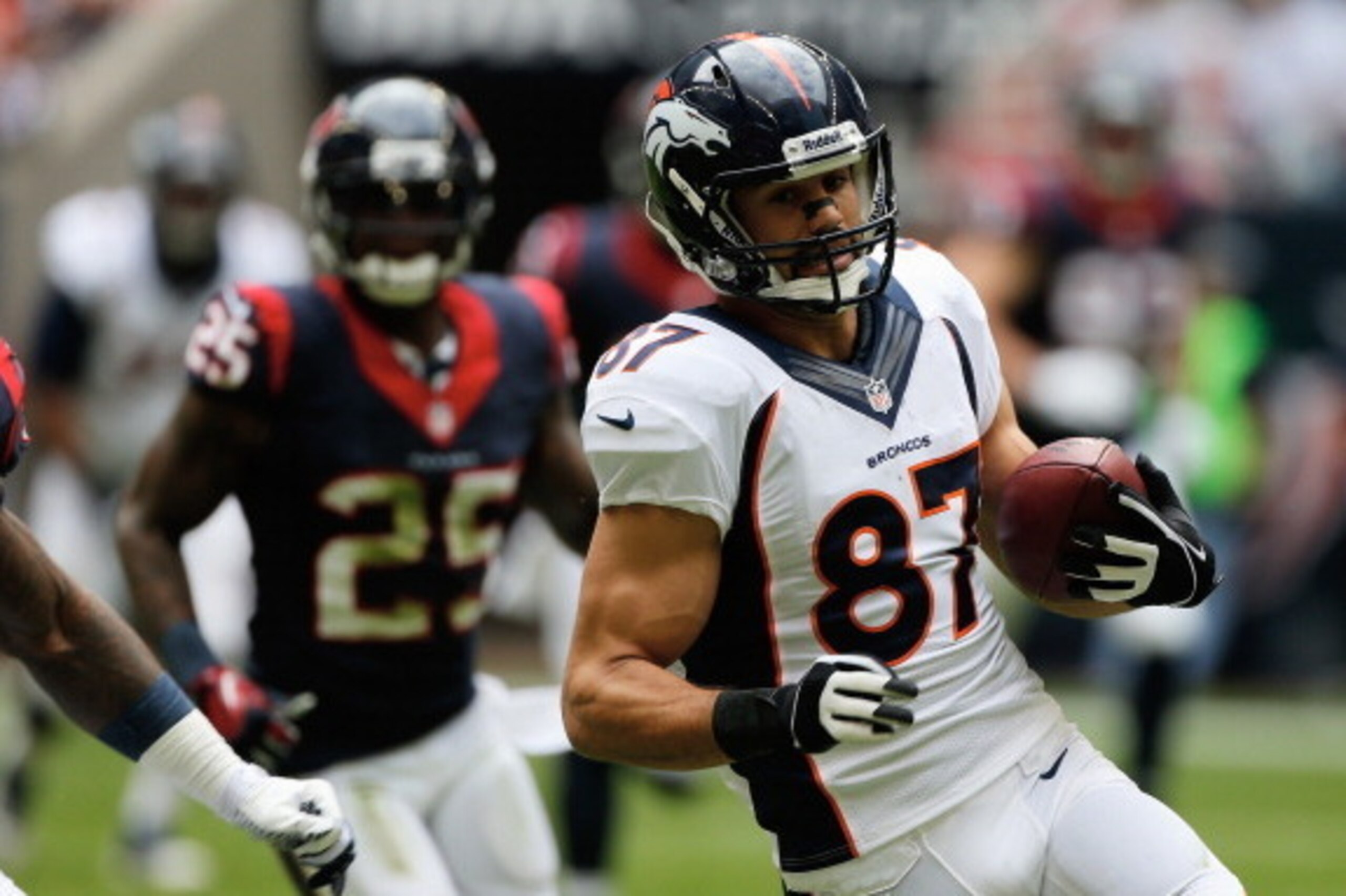 HOUSTON, TX - DECEMBER 22:  Eric Decker #87 of the Denver Broncos runs with the ball against the Houston Texans during the first half of the game against the Houston Texans at Reliant Stadium on December 22, 2013 in Houston, Texas.  (Photo by Scott Haller